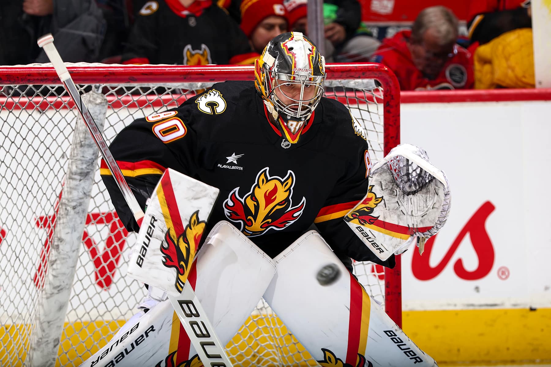 CALGARY, AB - JANUARY 2: Daniel Vladar #80 of the Calgary Flames makes a save during warmup prior to the game against the Utah Hockey Club at Scotiabank Saddledome on January 2, 2025 in Calgary, Alberta, Canada. (Photo by Gerry Thomas/NHLI via Getty Images)