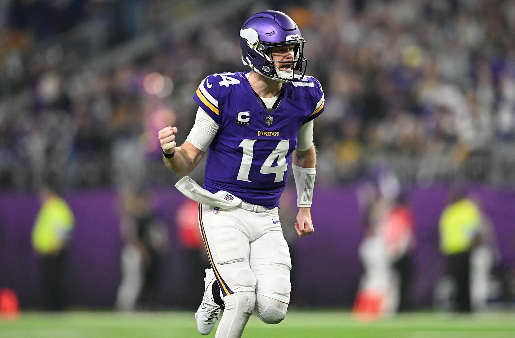 MINNEAPOLIS, MINNESOTA - DECEMBER 29: Quarterback Sam Darnold #14 of the Minnesota Vikings reacts after a throwing a touchdown pass during the second quarter against the Green Bay Packers at U.S. Bank Stadium on December 29, 2024 in Minneapolis, Minnesota. (Photo by Stephen Maturen/Getty Images)
