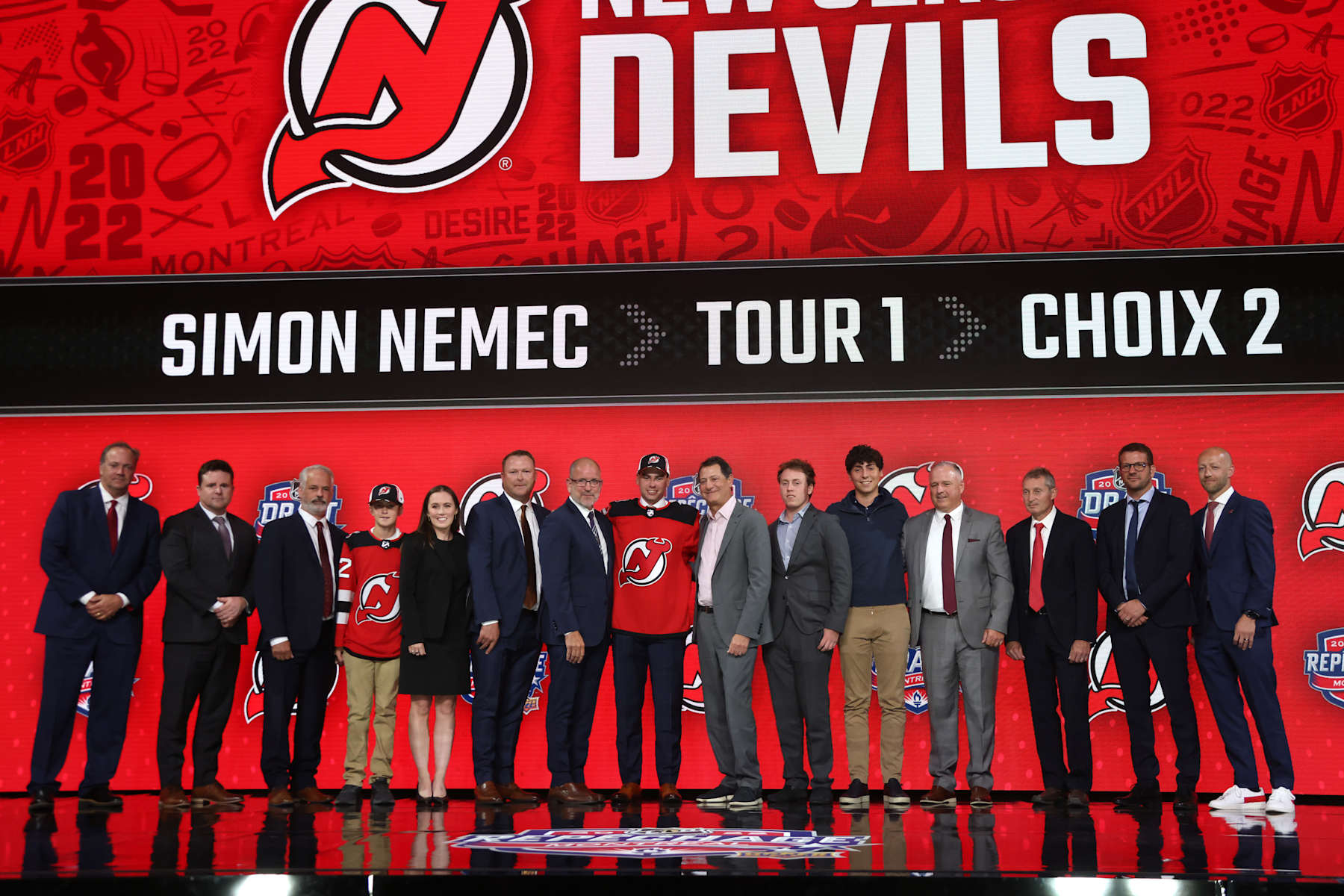 MONTREAL, QUEBEC - JULY 07: Simon Nemec of the New Jersey Devils, second overall pick of the 2022 Upper Deck NHL Draft, poses with team personnel onstage at Bell Centre on July 07, 2022 in Montreal, Quebec. (Photo by Dave Sandford/NHLI via Getty Images)