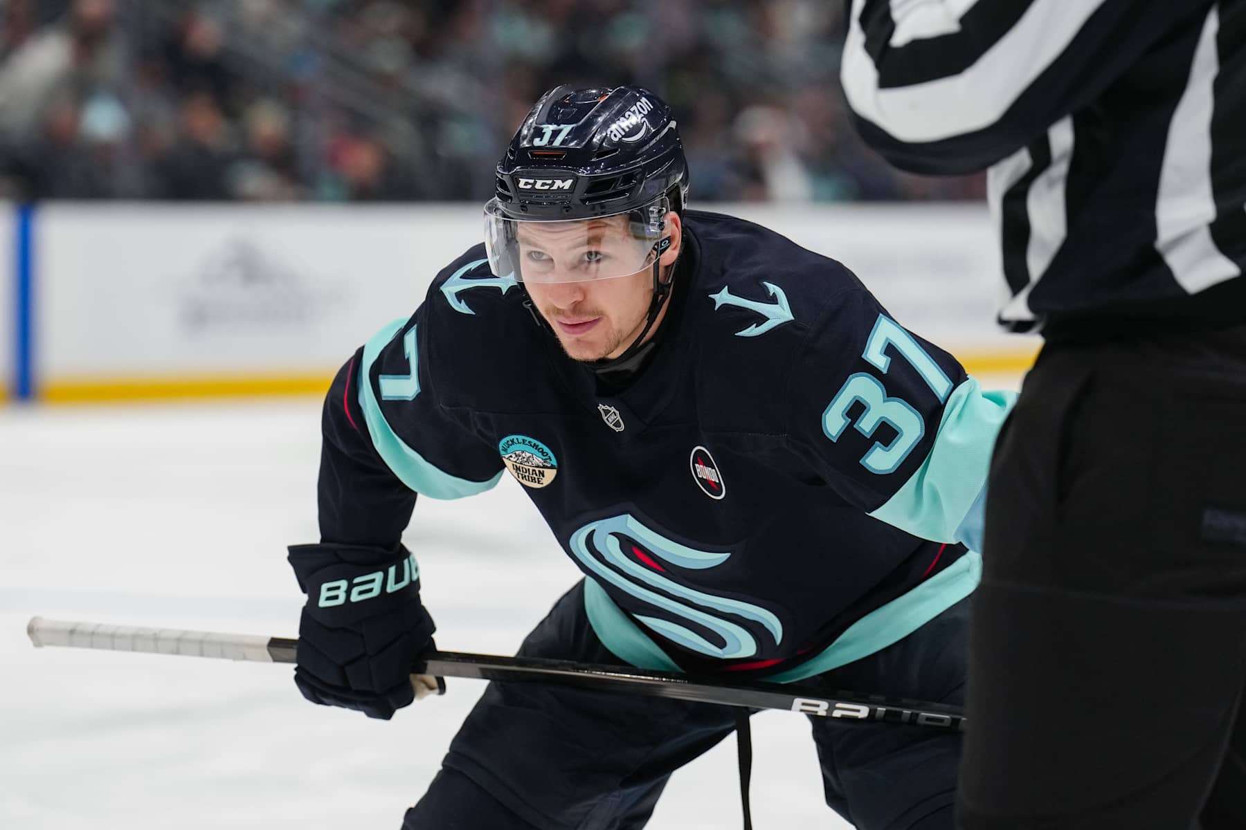 SEATTLE, WASHINGTON - JANUARY 02: Yanni Gourde #37 of the Seattle Kraken prepares for a face-off during the first period of a game against the Vancouver Canucks at Climate Pledge Arena on January 02, 2025 in Seattle, Washington. (Photo by Christopher Mast/2025 NHLI)
