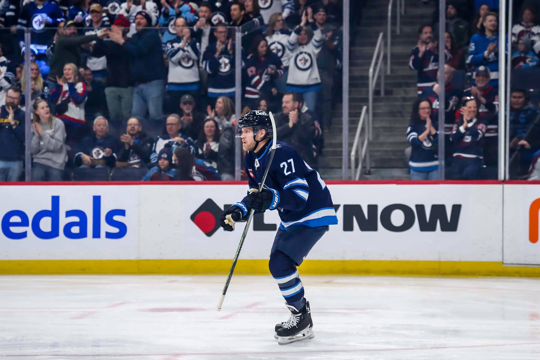 WINNIPEG, CANADA - JANUARY 11: Nikolaj Ehlers #27 of the Winnipeg Jets skates back to the bench after celebrating his first period goal against the Colorado Avalanche at the Canada Life Centre on January 11, 2025 in Winnipeg, Manitoba, Canada. (Photo by Darcy Finley/NHLI via Getty Images)