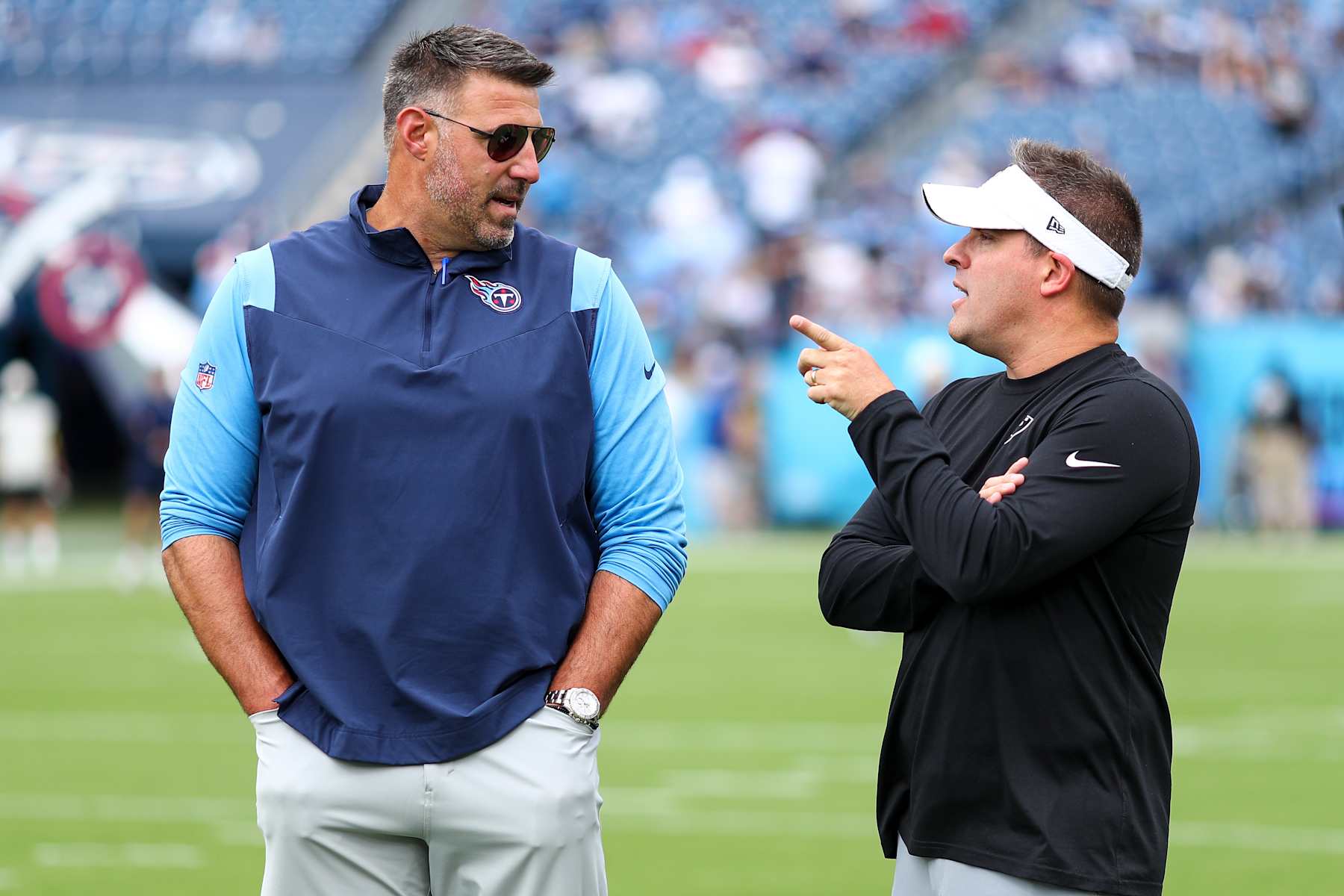 NASHVILLE, TN - SEPTEMBER 25: Head coach Mike Vrabel of the Tennessee Titans talks with head coach Josh McDaniels of the Las Vegas Raiders prior to an NFL football game at Nissan Stadium on September 25, 2022 in Nashville, Tennessee. (Photo by Kevin Sabitus/Getty Images)