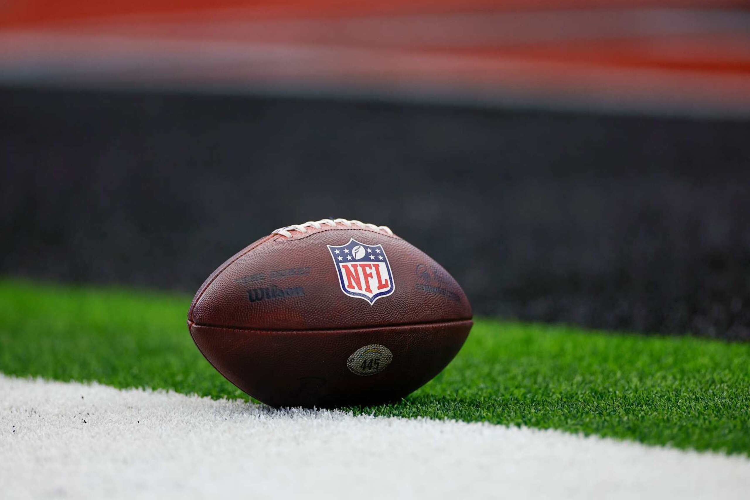 HOUSTON, TEXAS - JANUARY 11: The NFL Shield logo on the ball prior to the AFC Wild Card Playoff game between the Los Angeles Chargers and Houston Texans at NRG Stadium on January 11, 2025 in Houston, Texas. (Photo by Brandon Sloter/Getty Images)