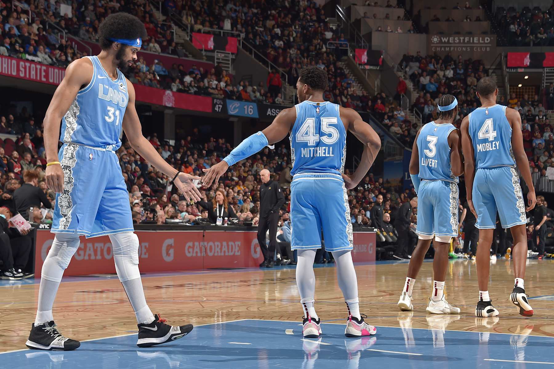 CLEVELAND, OH - JANUARY 12: Jarrett Allen #31 and Donovan Mitchell high five during the game against the Indiana Pacers on January 12, 2025 at Rocket Mortgage FieldHouse in Cleveland, Ohio. NOTE TO USER: User expressly acknowledges and agrees that, by downloading and/or using this Photograph, user is consenting to the terms and conditions of the Getty Images License Agreement. Mandatory Copyright Notice: Copyright 2025 NBAE (Photo by David Liam Kyle/NBAE via Getty Images)