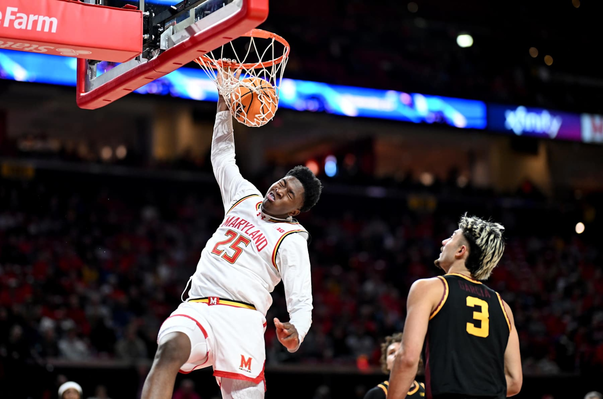 COLLEGE PARK, MARYLAND - JANUARY 13: Derik Queen #25 of the Maryland Terrapins dunks the ball in the second half against Dawson Garcia #3 of the Minnesota Golden Gophers at Xfinity Center on January 13, 2025 in College Park, Maryland. (Photo by G Fiume/Getty Images)