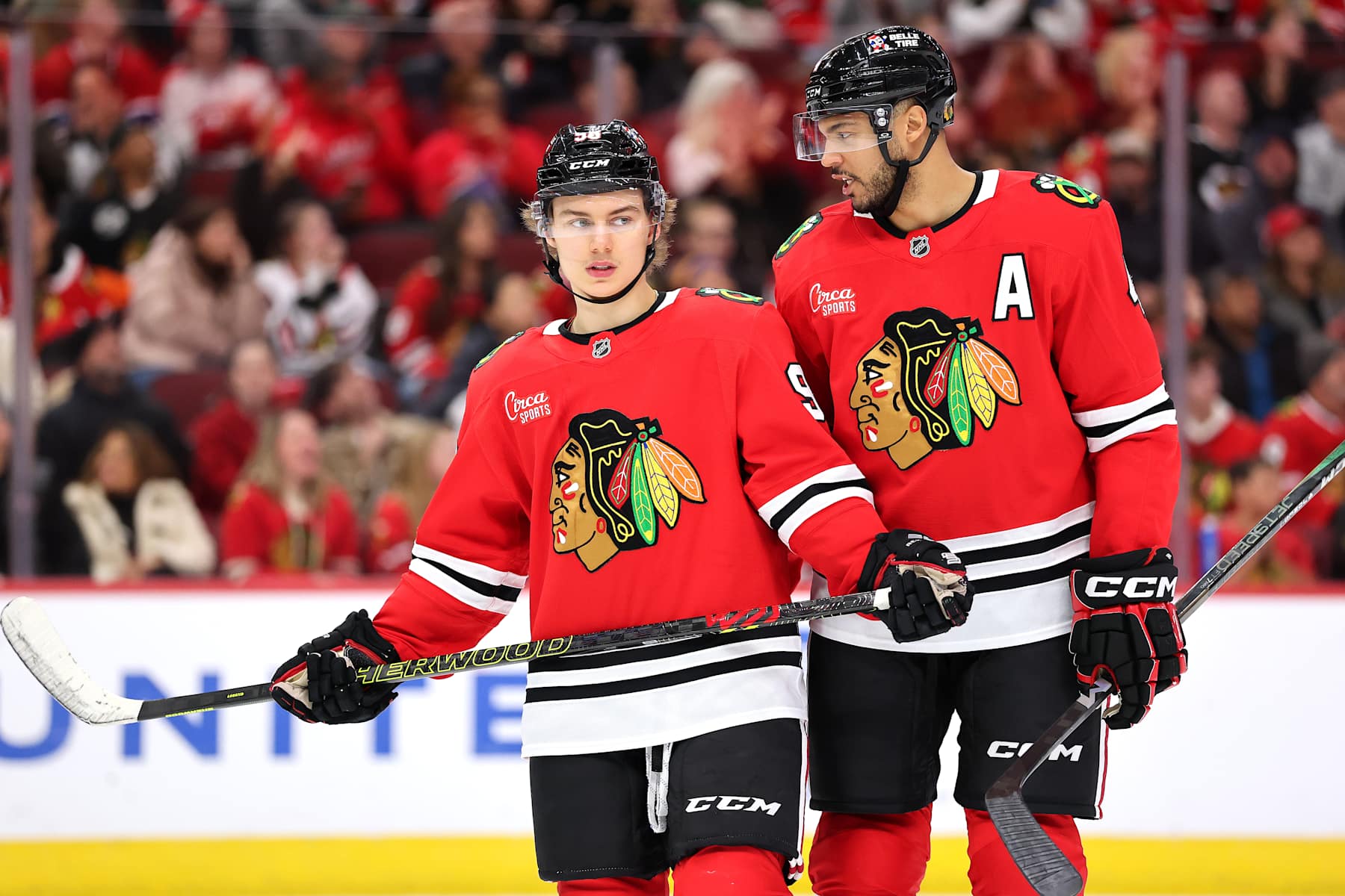 CHICAGO, ILLINOIS - JANUARY 03: Connor Bedard #98 and Seth Jones #4 of the Chicago Blackhawks look on against the Montreal Canadiens during the third period at the United Center on January 03, 2025 in Chicago, Illinois. (Photo by Michael Reaves/Getty Images)