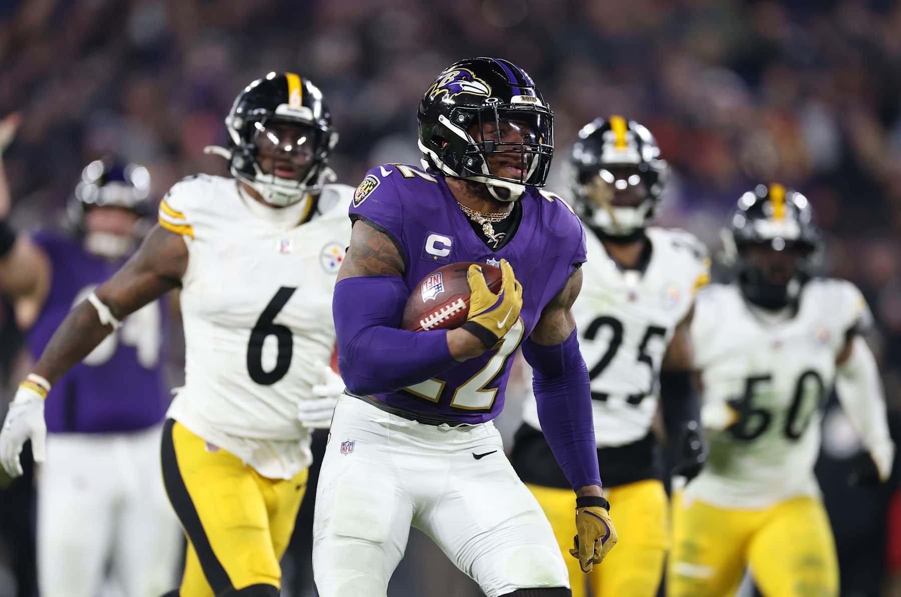 BALTIMORE, MARYLAND - JANUARY 11: Derrick Henry #22 of the Baltimore Ravens runs the ball for a touchdown during the third quarter against the Pittsburgh Steelers during the AFC Wild Card Playoff at M&T Bank Stadium on January 11, 2025 in Baltimore, Maryland.  (Photo by Al Bello/Getty Images)
