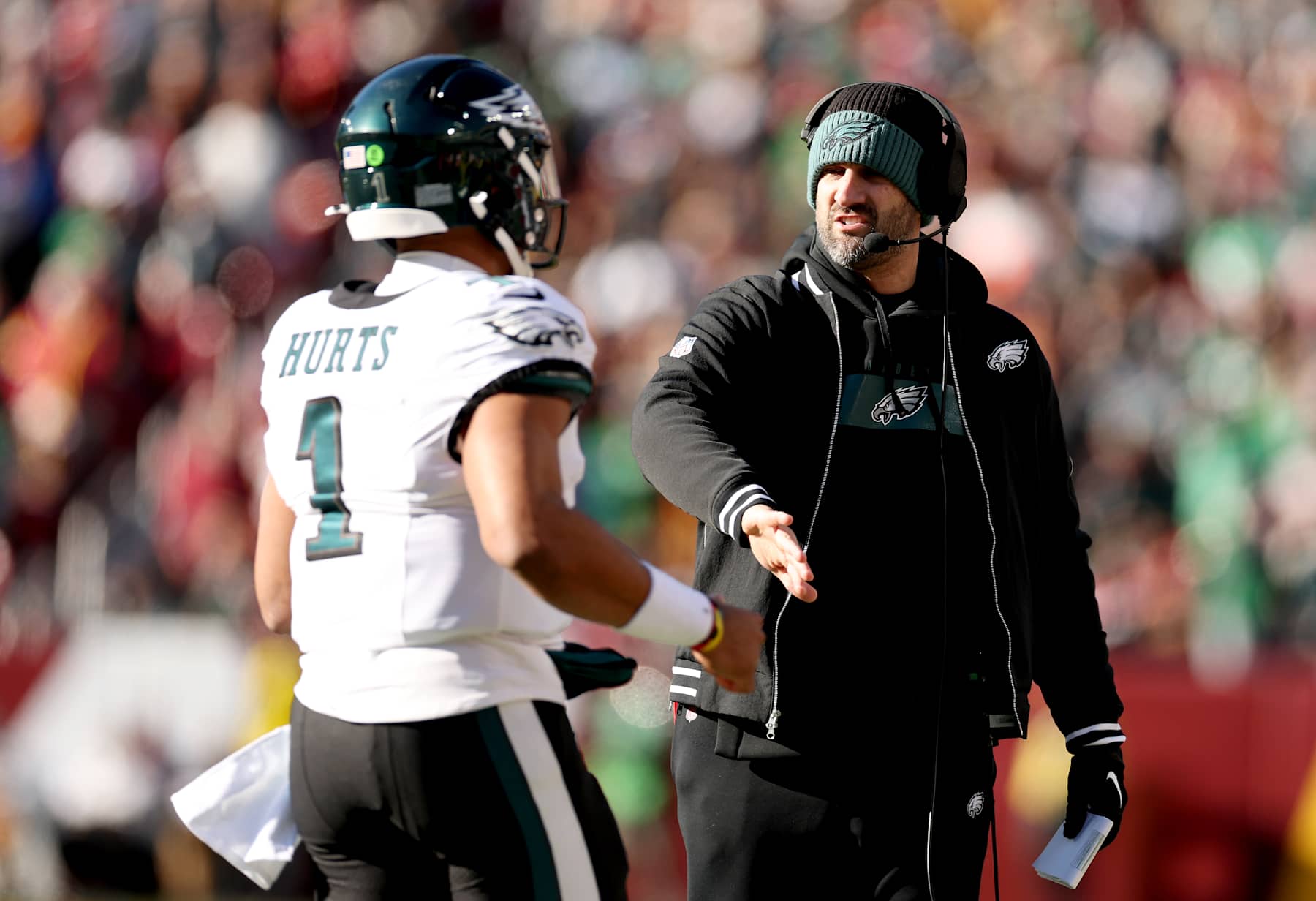 LANDOVER, MARYLAND - DECEMBER 22:  Jalen Hurts #1 of the Philadelphia Eagles is congratulated by head coach Nick Sirianni after a first quarter touchdown against the Washington Commanders at Northwest Stadium on December 22, 2024 in Landover, Maryland. (Photo by Scott Taetsch/Getty Images)