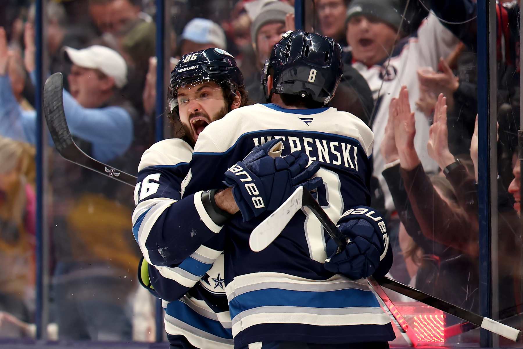 COLUMBUS, OHIO - JANUARY 14: Zach Werenski #8 of the Columbus Blue Jackets is congratulated by Kirill Marchenko #86 after scoring the game tying goal during the third period of the game against the Philadelphia Flyers at Nationwide Arena on January 14, 2025 in Columbus, Ohio. Columbus defeated Philadelphia 3-2 in a shootout. (Photo by Kirk Irwin/NHLI via Getty Images)