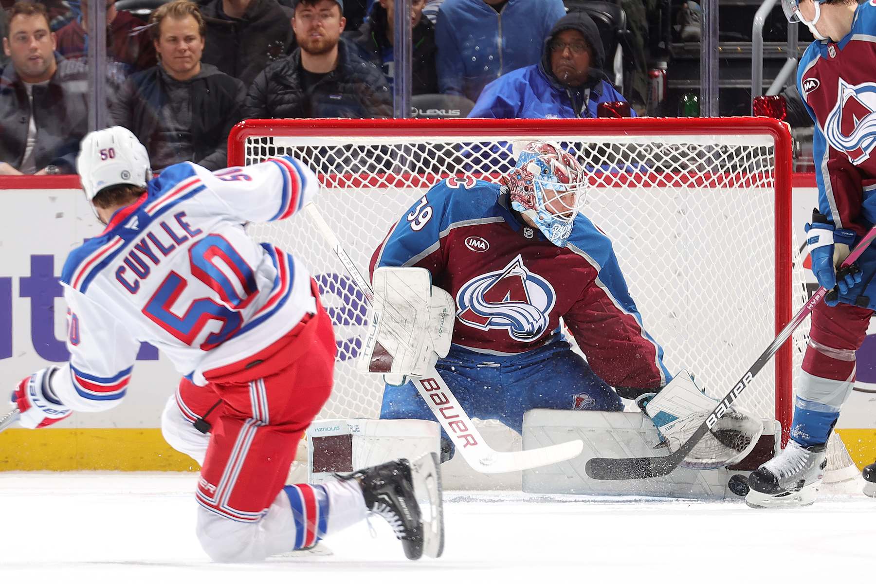 DENVER, COLORADO - JANUARY 14: Will Cuylle #50 of the New York Rangers shoots against goaltender Mackenzie Blackwood #39 of the Colorado Avalanche at Ball Arena on January 14, 2025 in Denver, Colorado. (Photo by Michael Martin/NHLI via Getty Images)