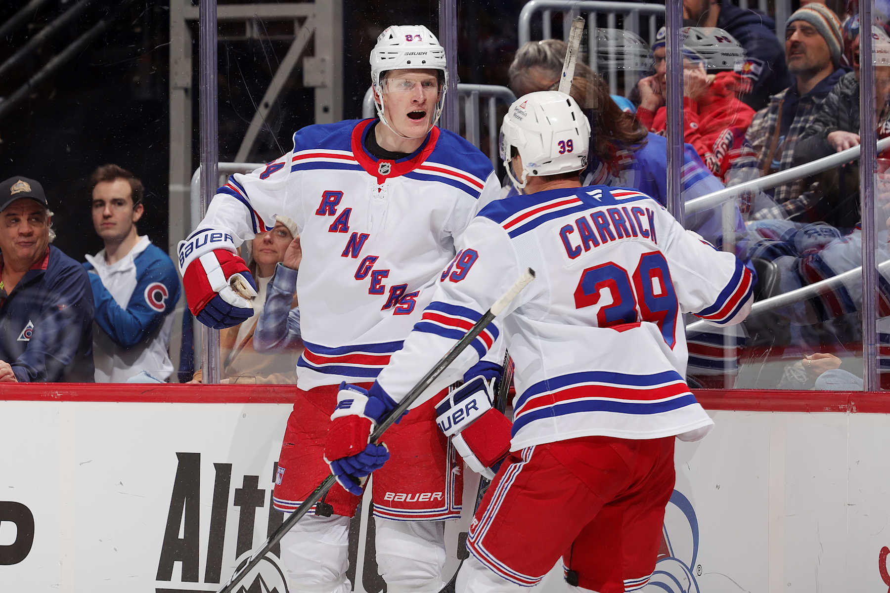DENVER, COLORADO - JANUARY 14: Adam Edstrom #84 and Sam Carrick #39 of the New York Rangers celebrate a goal against the Colorado Avalanche at Ball Arena on January 14, 2025 in Denver, Colorado. (Photo by Michael Martin/NHLI via Getty Images)