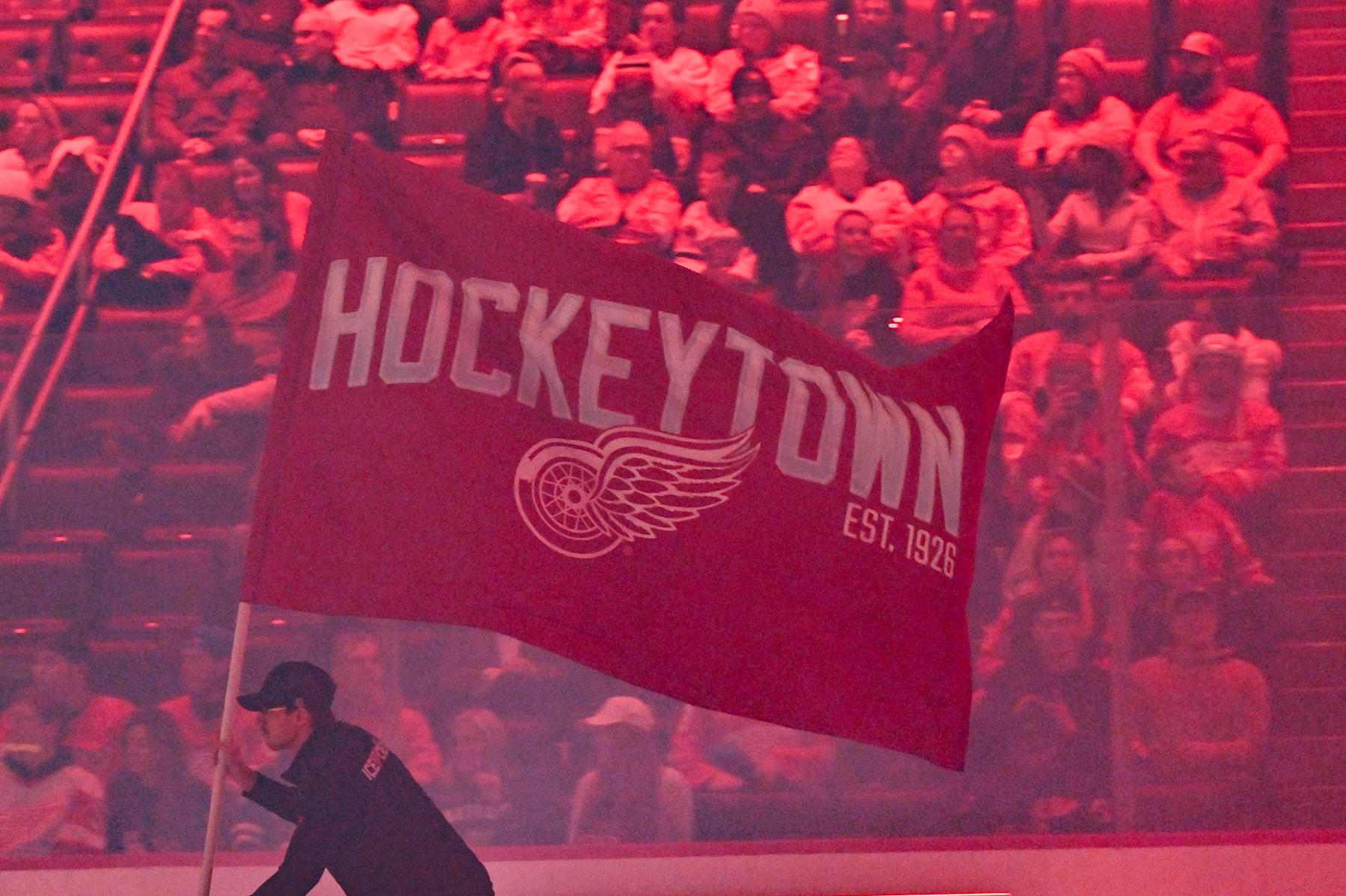 DETROIT, MI - JANUARY 14: The Detroit Red Wings ice crew skate around with the Hockeytown flag prior to the game between the Detroit Red Wings and the San Jose Sharks Tuesday January 14, 2025 at Little Caesars Arena in Detroit, MI. (Photo by Steven King/Icon Sportswire via Getty Images)