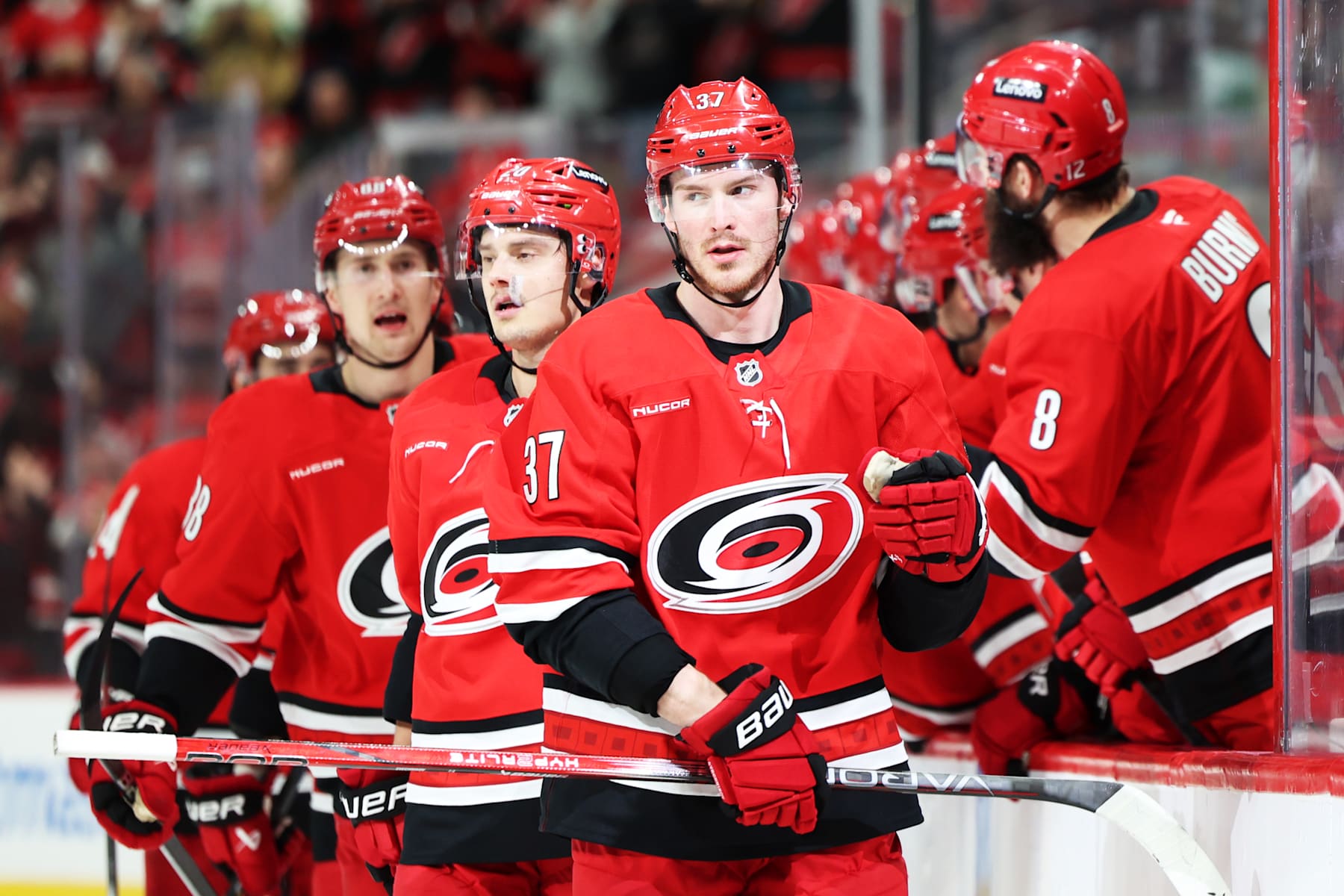 RALEIGH, NORTH CAROLINA - JANUARY 12: Andrei Svechnikov #37 of the Carolina Hurricanes skates past his teammates on the bench to celebrate his goal during the third period against the Anaheim Ducks at Lenovo Center on January 12, 2025 in Raleigh, North Carolina. (Photo by Katie Januck/Getty Images)