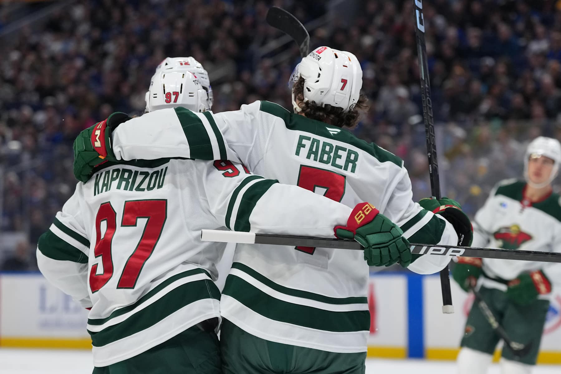 BUFFALO, NEW YORK - NOVEMBER 27: Kirill Kaprizov #97 of the Minnesota Wild celebrates with Brock Faber #7 after a goal during the first period of an NHL game against the Buffalo Sabres on November 27, 2024 at KeyBank Center in Buffalo, New York. (Photo by Chris Conaway Jr./NHLI via Getty Images)