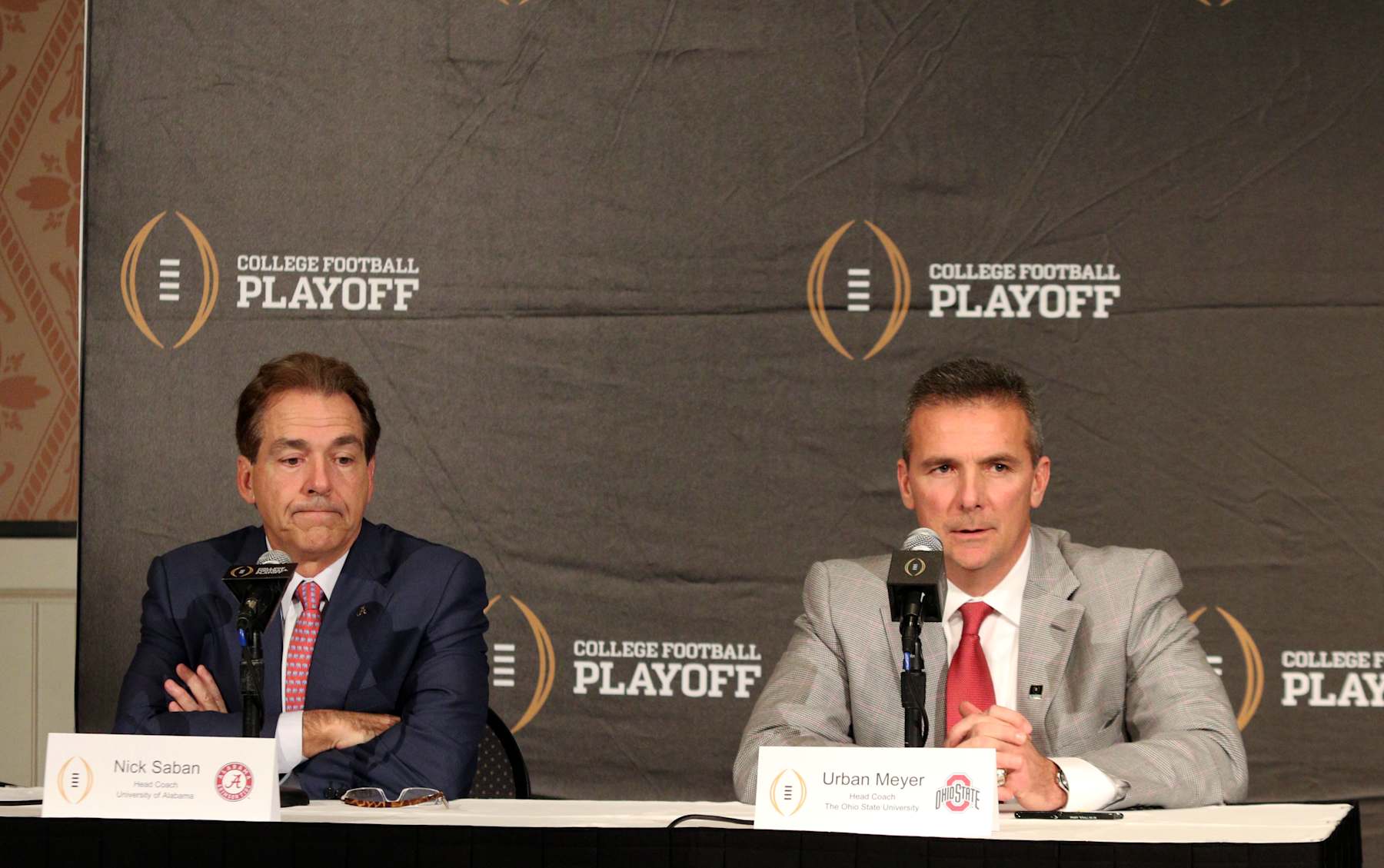 Dec 11, 2014; Lake Buena Vista, FL USA; Alabama Crimson Tide head coach Nick Saban (left) and Ohio State Buckeyes head coach Urban Meyer (right) address the media during a press conference for the College Football Playoff Semifinal at Disney's Boardwalk Conference Center. (Photo by Douglas Jones/Icon Sportswire/Corbis/Icon Sportswire via Getty Images)