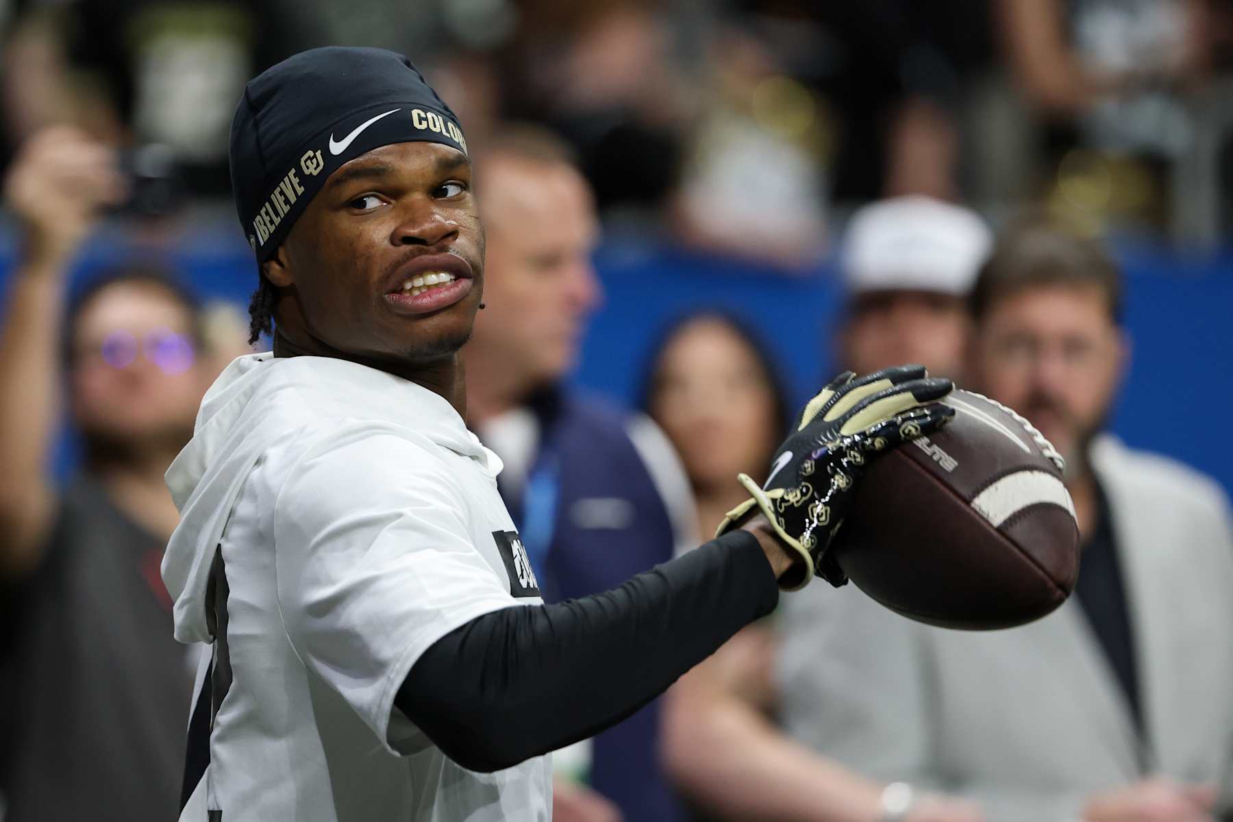 SAN ANTONIO, TX - DECEMBER 28: Colorado Buffaloes wide receiver Travis Hunter (12) holds a ball after practicing one-handed catches before the football game between BYU Cougars and Colorado Buffalos on December 28, 2024, at the Alamodome in San Antonio, Texas. (Photo by David Buono/Icon Sportswire via Getty Images)