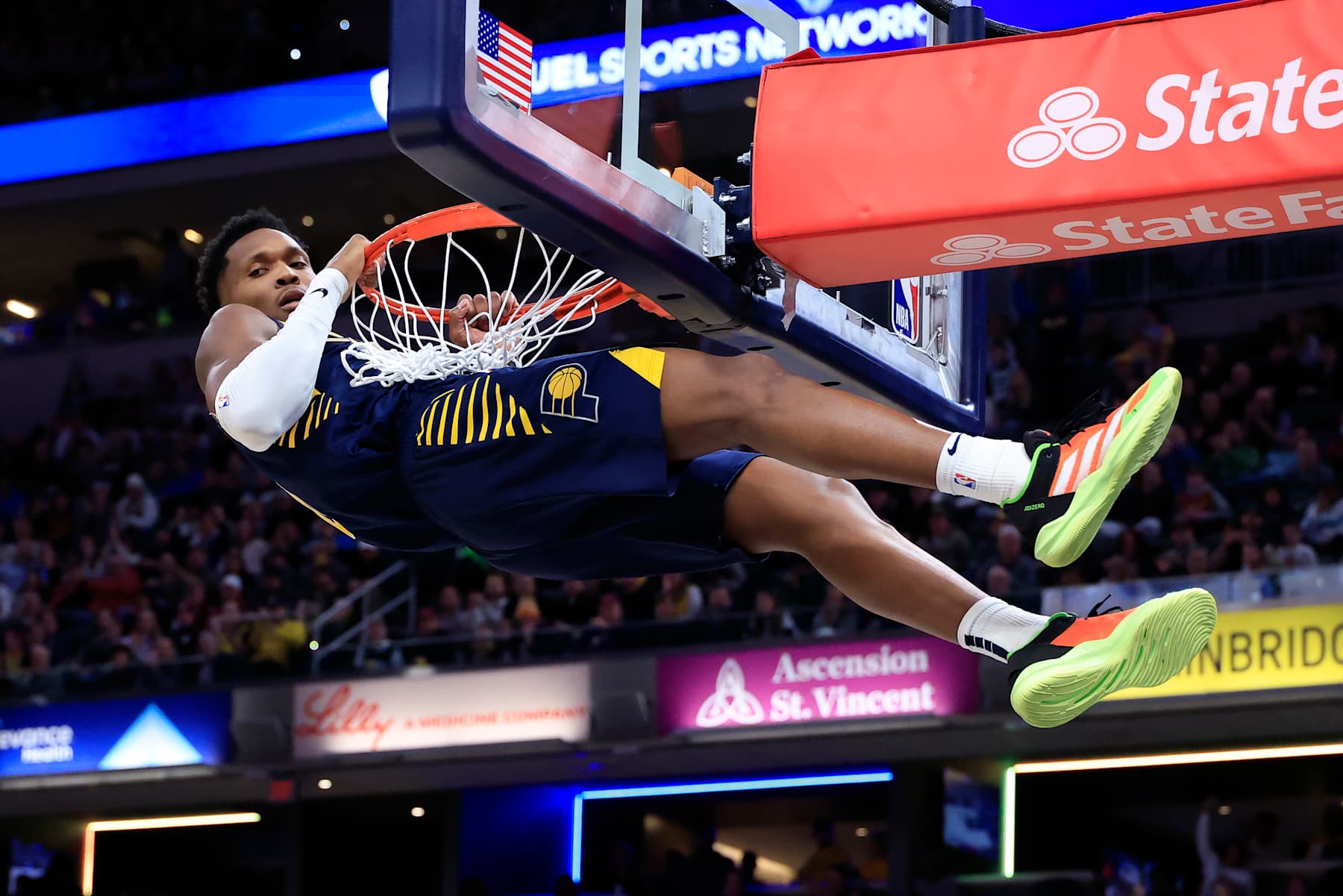 INDIANAPOLIS, INDIANA - JANUARY 14: Bennedict Mathurin #00 of the Indiana Pacers hangs on the rim after a dunk against the Cleveland Cavaliers during the first half at Gainbridge Fieldhouse on January 14, 2025 in Indianapolis, Indiana. NOTE TO USER: User expressly acknowledges and agrees that, by downloading and or using this photograph, User is consenting to the terms and conditions of the Getty Images License Agreement. (Photo by Justin Casterline/Getty Images)