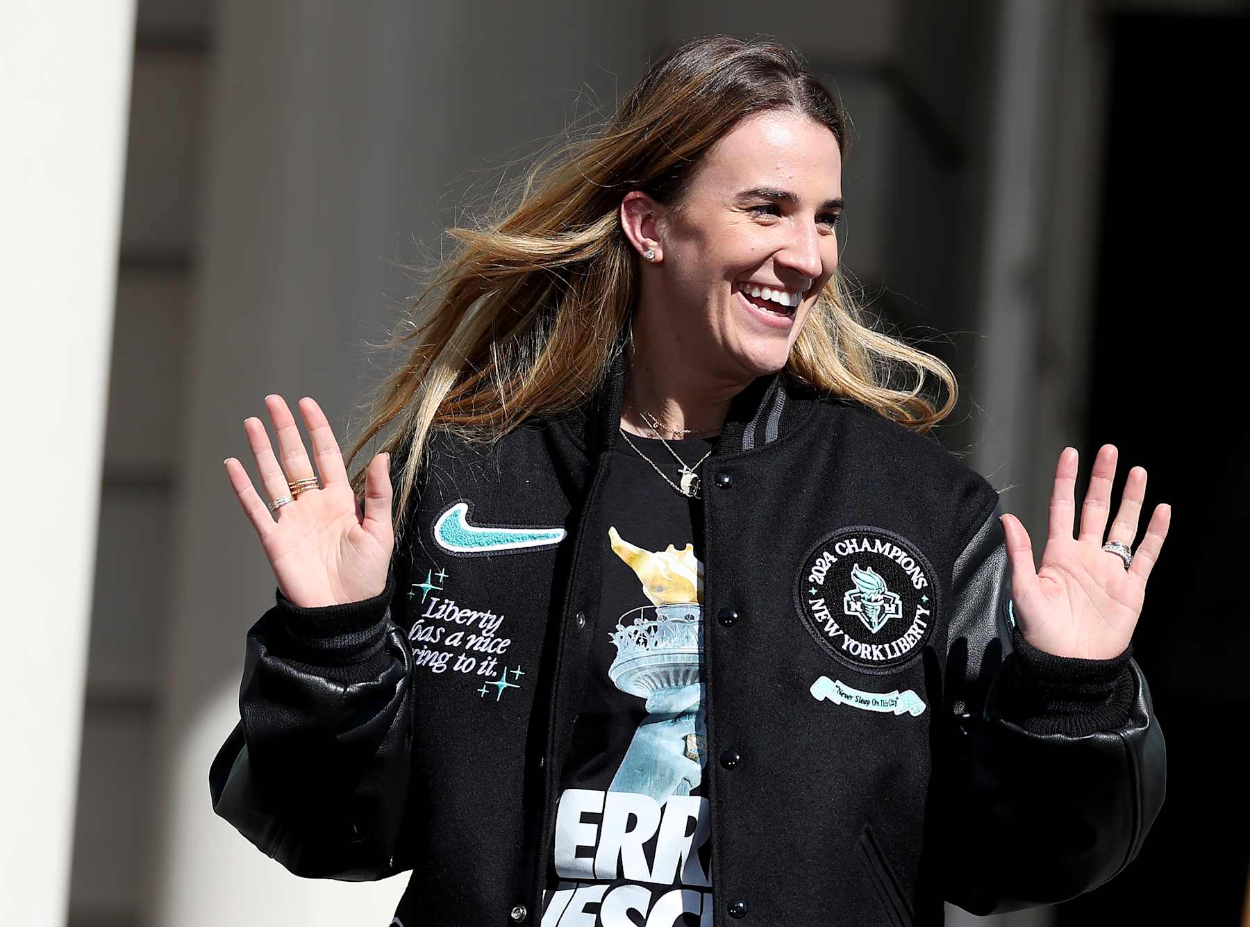 NEW YORK, NEW YORK - OCTOBER 24: Sabrina Ionescu #20 of the New York Liberty waves as she is announced during the Championship ticker tape parade and victory rally celebrating winning the 2024 WNBA Finals on October 24, 2024 in New York City. NOTE TO USER: User expressly acknowledges and agrees that, by downloading and/or using this photograph, user is consenting to the terms and conditions of the Getty Images License Agreement. (Photo by Elsa/Getty Images)