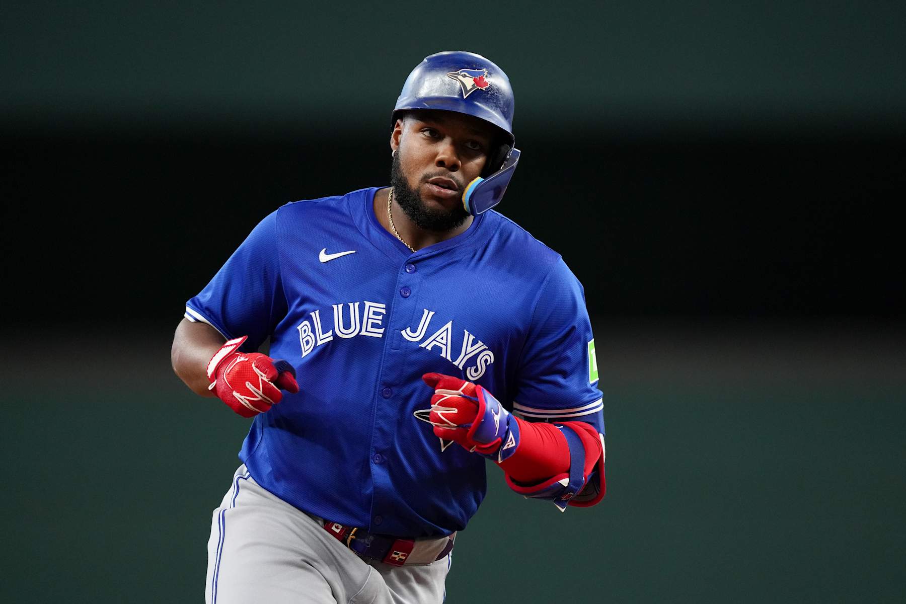 ARLINGTON, TEXAS - SEPTEMBER 19: Vladimir Guerrero Jr. #27 of the Toronto Blue Jays celebrates as he runs the bases after hitting a solo home run during the seventh inning against the Texas Rangers at Globe Life Field on September 19, 2024 in Arlington, Texas. (Photo by Sam Hodde/Getty Images)