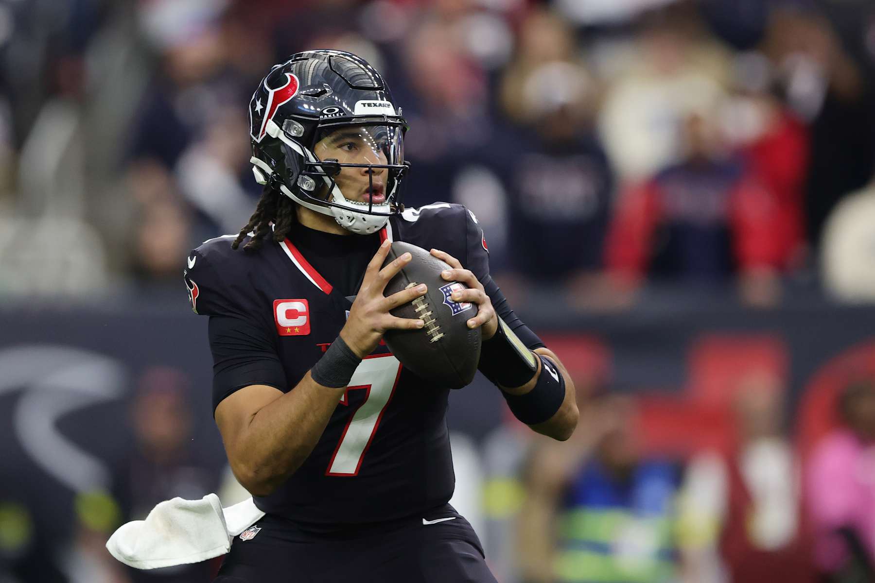 HOUSTON, TEXAS - JANUARY 11: C.J. Stroud #7 of the Houston Texans drops back to pass against the Los Angeles Chargers in the first half during the AFC Wild Card Playoffs at NRG Stadium on January 11, 2025 in Houston, Texas. (Photo by Alex Slitz/Getty Images)