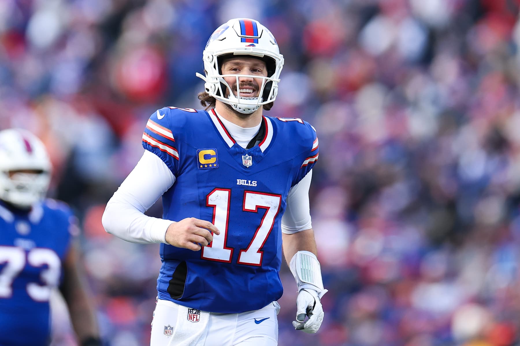 ORCHARD PARK, NEW YORK - JANUARY 12: Josh Allen #17 of the Buffalo Bills smiles after a touchdown is scored during the fourth quarter against the Denver Broncos at Highmark Stadium on January 12, 2025 in Orchard Park, New York. (Photo by Kathryn Riley/Getty Images)