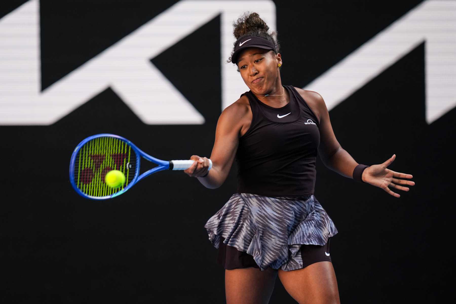 MELBOURNE, AUSTRALIA - JANUARY 17: Naomi Osaka of Japan plays a forehand in the Women's Singles Third Round match against Belinda Bencic of Switzerland during day six of the 2025 Australian Open at Melbourne Park on January 17, 2025 in Melbourne, Australia. (Photo by Shi Tang/Getty Images)