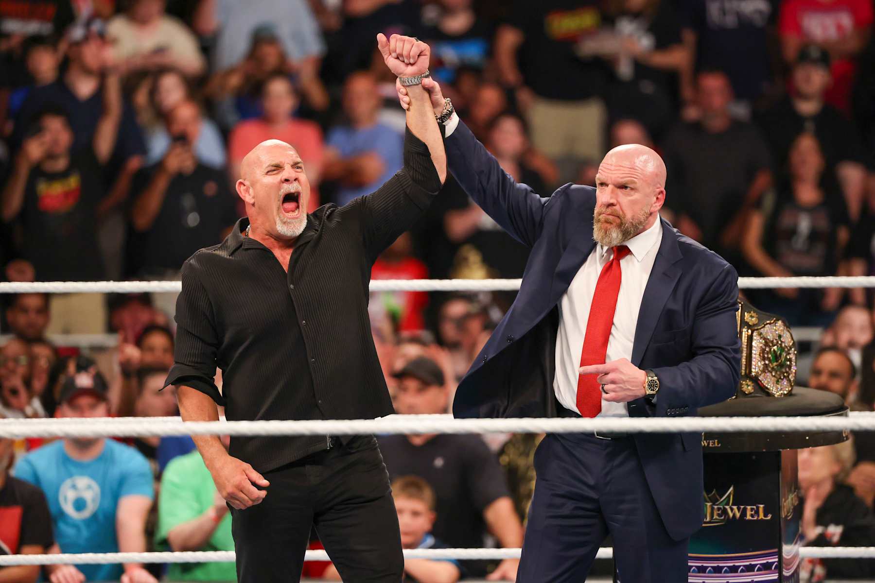 ATLANTA, GEORGIA - OCTOBER 5: Bill Goldberg poses in the ring with Triple H during Bad Blood at State Farm Arena on October 5, 2024 in Atlanta, Georgia. (Photo by WWE/Getty Images)