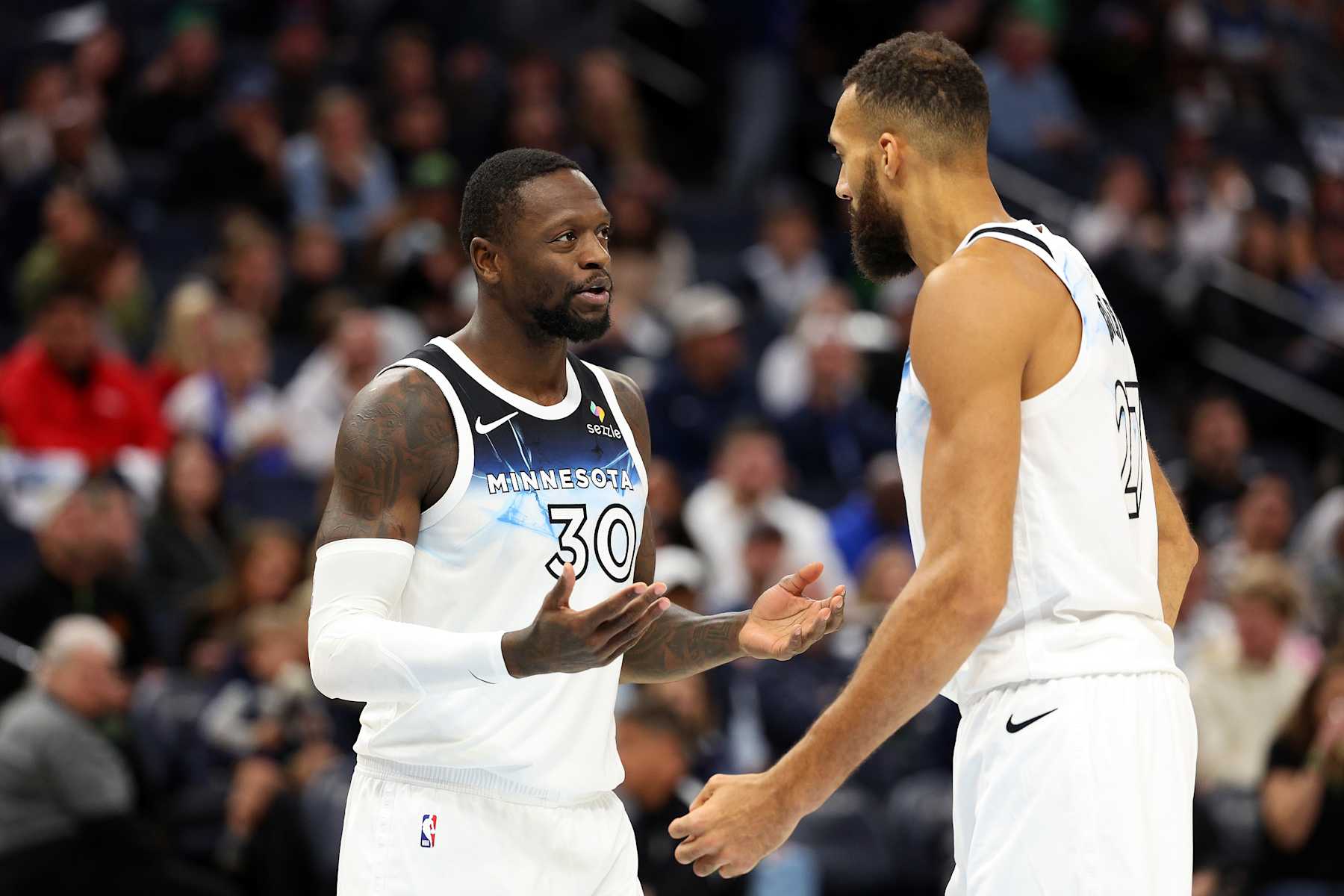 MINNEAPOLIS, MINNESOTA - NOVEMBER 17: Julius Randle #30 talks to Rudy Gobert #27 of the Minnesota Timberwolves in the third quarter against the Phoenix Suns at Target Center on November 17, 2024 in Minneapolis, Minnesota. The Timberwolves defeated the Suns 120-117. NOTE TO USER: User expressly acknowledges and agrees that, by downloading and or using this photograph, User is consenting to the terms and conditions of the Getty Images License Agreement. (Photo by David Berding/Getty Images)