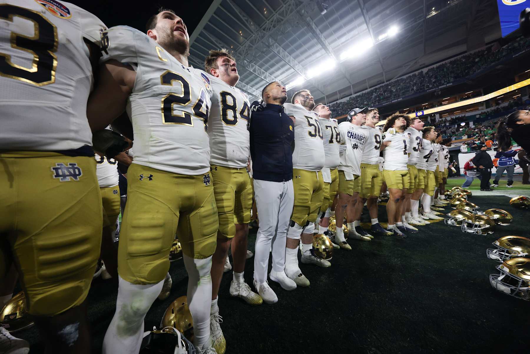 MIAMI GARDENS, FLORIDA - JANUARY 9: Head coach Marcus Freeman of the Notre Dame Fighting Irish sings the alma matter with his team after the 2025 Orange Bowl against the Penn State Nittany Lions at Hard Rock Stadium on January 9, 2025 in Miami Gardens, Florida. (Photo by CFP/Getty Images)