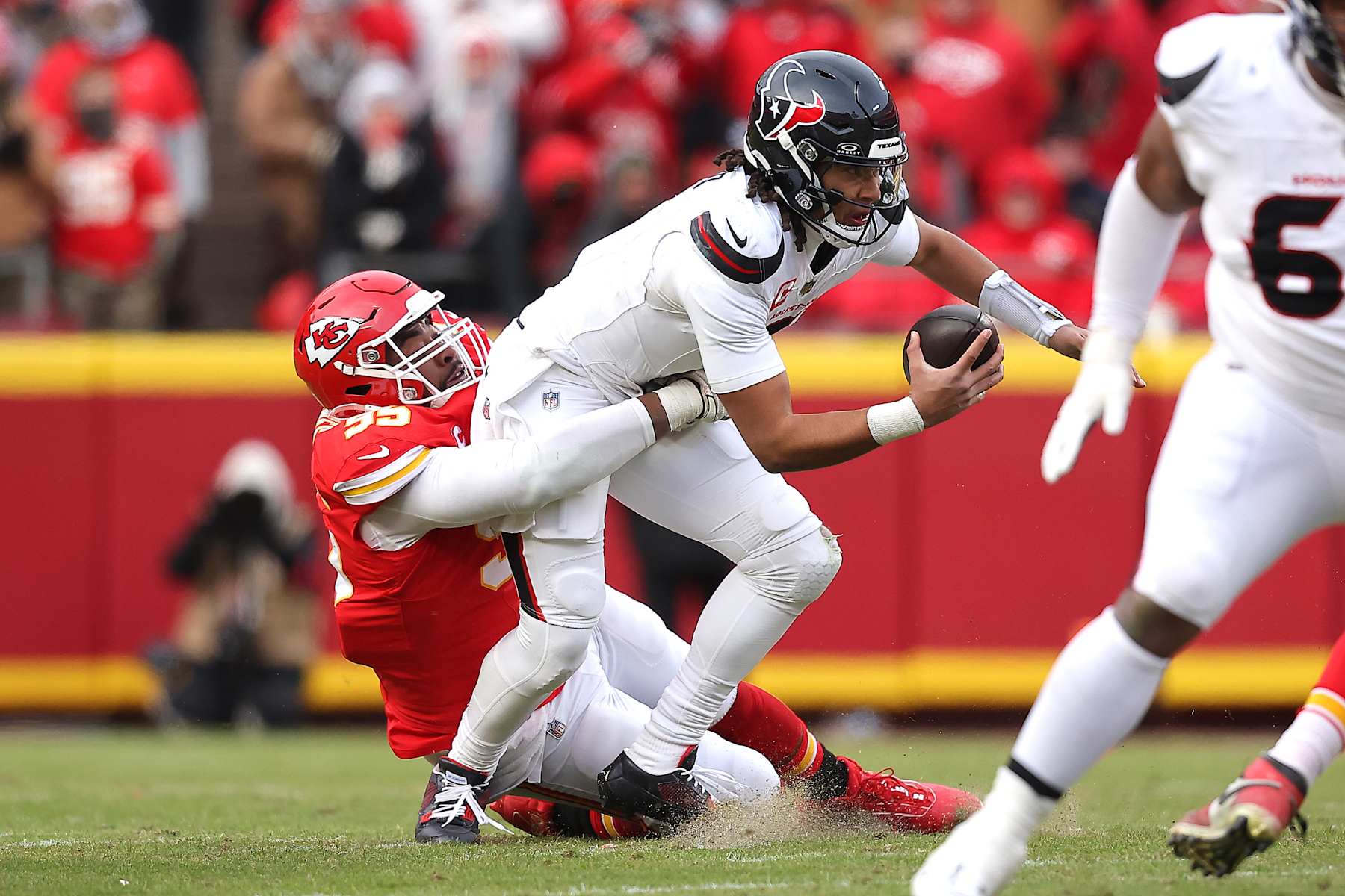 KANSAS CITY, MISSOURI - JANUARY 18: Chris Jones #95 of the Kansas City Chiefs sacks C.J. Stroud #7 of the Houston Texans during the first quarter in the AFC Divisional Playoff at GEHA Field at Arrowhead Stadium on January 18, 2025 in Kansas City, Missouri. (Photo by David Eulitt/Getty Images)