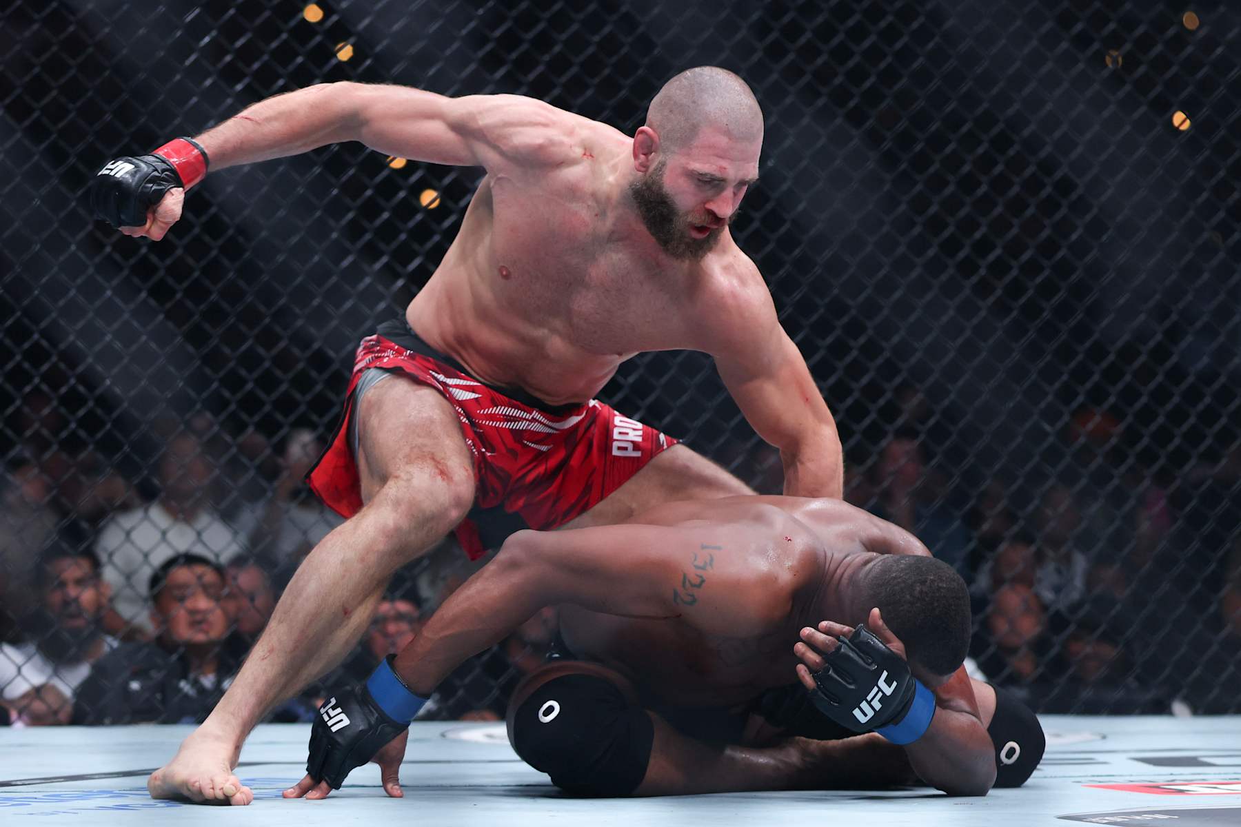 INGLEWOOD, CALIFORNIA - JANUARY 18: Jiří Procházka of Czechia punches Jamahal Hill of the United States in a light heavyweight fight during UFC 311 at Intuit Dome on January 18, 2025 in Inglewood, California. (Photo by Harry How/Getty Images)