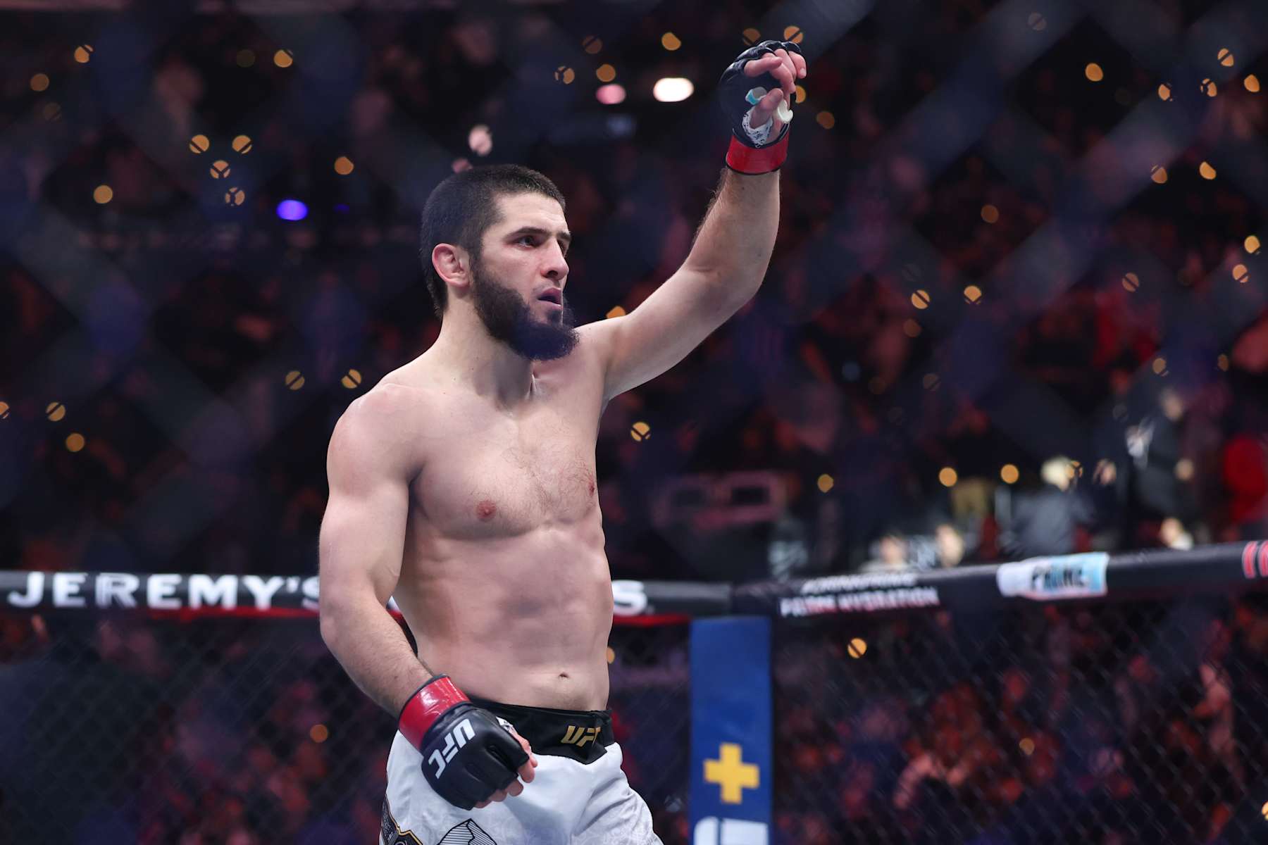 INGLEWOOD, CALIFORNIA - JANUARY 18: Islam Makhachev of Russia reacts after his victor by submission over Renato Moicano of Brazil, not pictured, in a lightweight title fight during UFC 311 at Intuit Dome on January 18, 2025 in Inglewood, California. (Photo by Harry How/Getty Images)