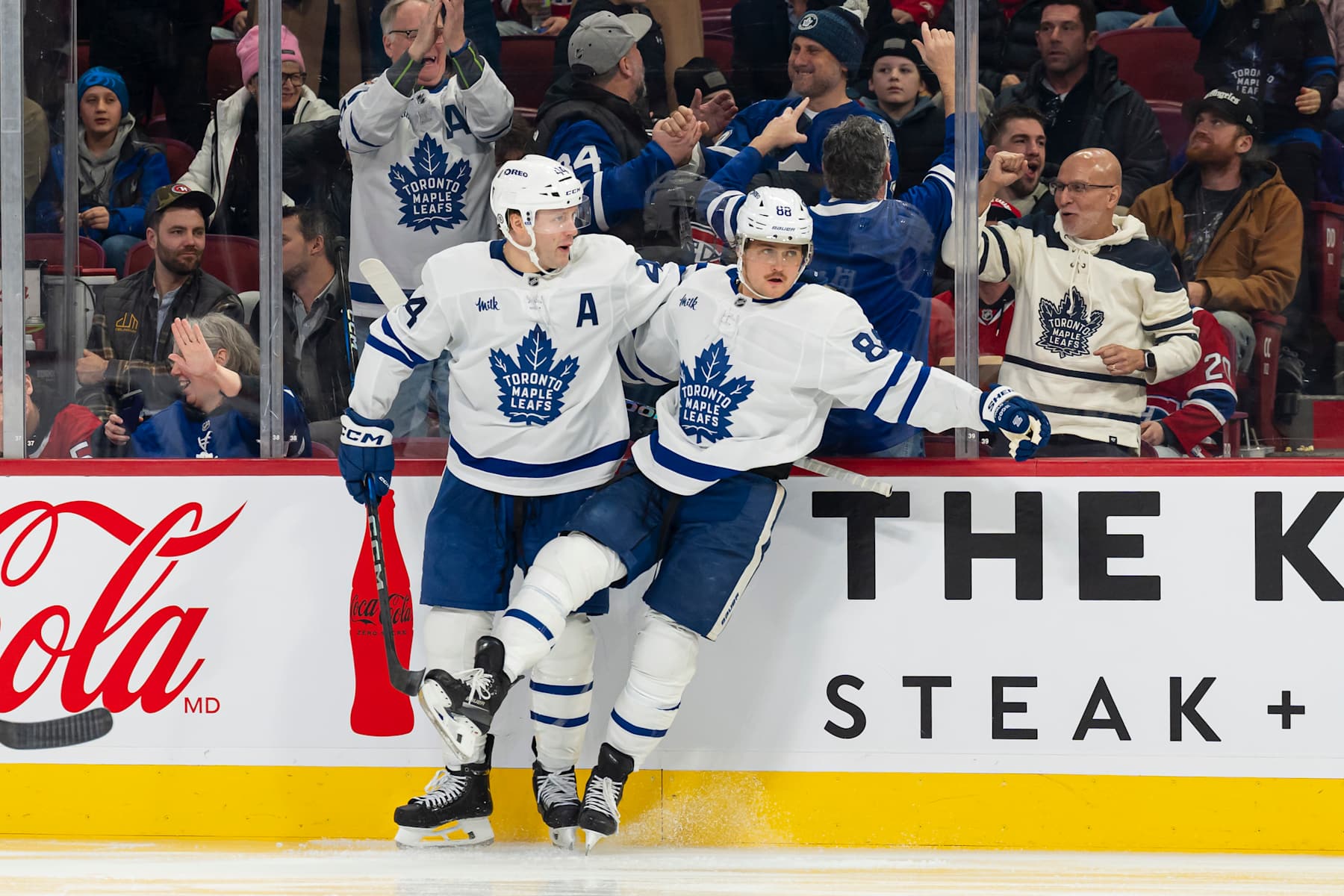MONTREAL, CANADA - JANUARY 18: William Nylander #88 celebrates with Morgan Rielly #44 of the Toronto Maple Leafs after scoring against the Montreal Canadiens during the third period at the Bell Centre on January 18, 2025 in Montreal, Quebec, Canada. (Photo by Arianne Bergeron/NHLI via Getty Images)
