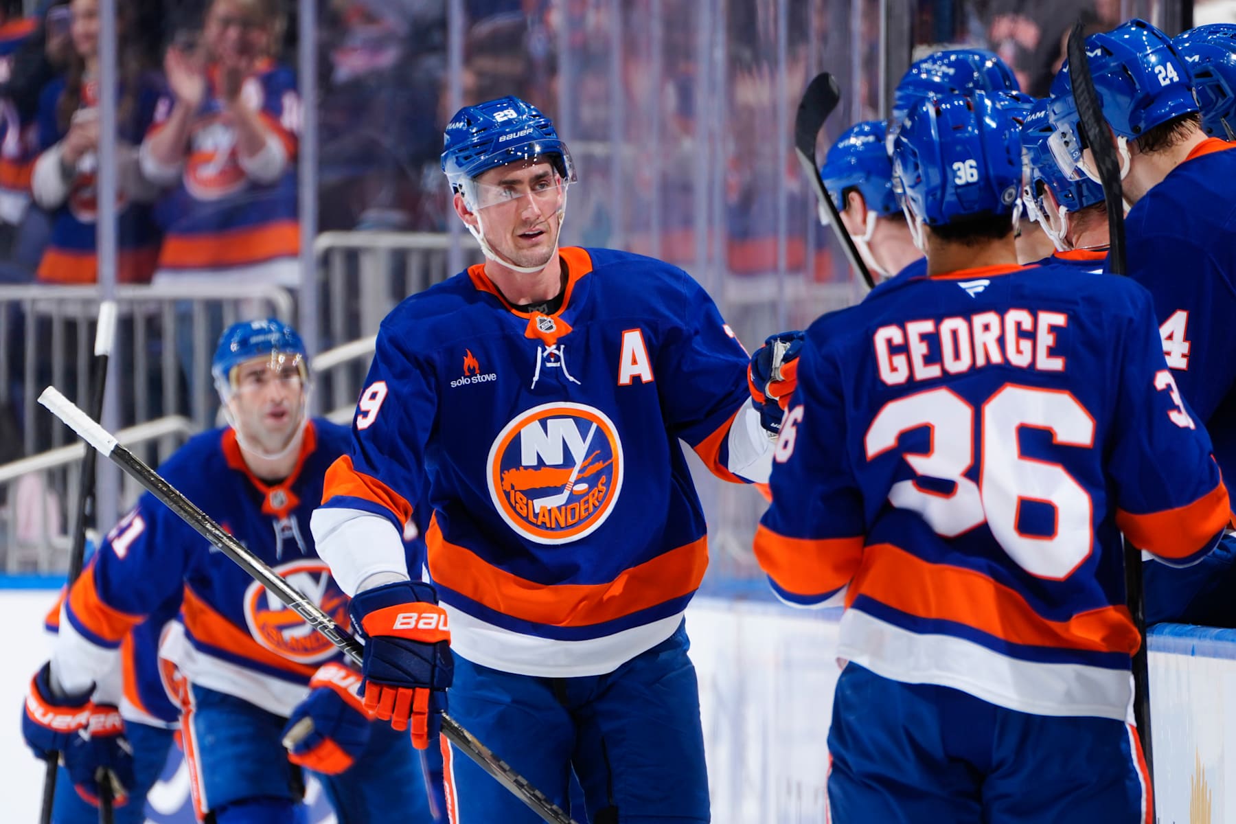 ELMONT, NEW YORK - JANUARY 18: Brock Nelson #29 of the New York Islanders is congratulated by his teammates after scoring a goal against the San Jose Sharks during the second period at UBS Arena on January 18, 2025 in Elmont, New York. (Photo by Mike Stobe/NHLI via Getty Images)
