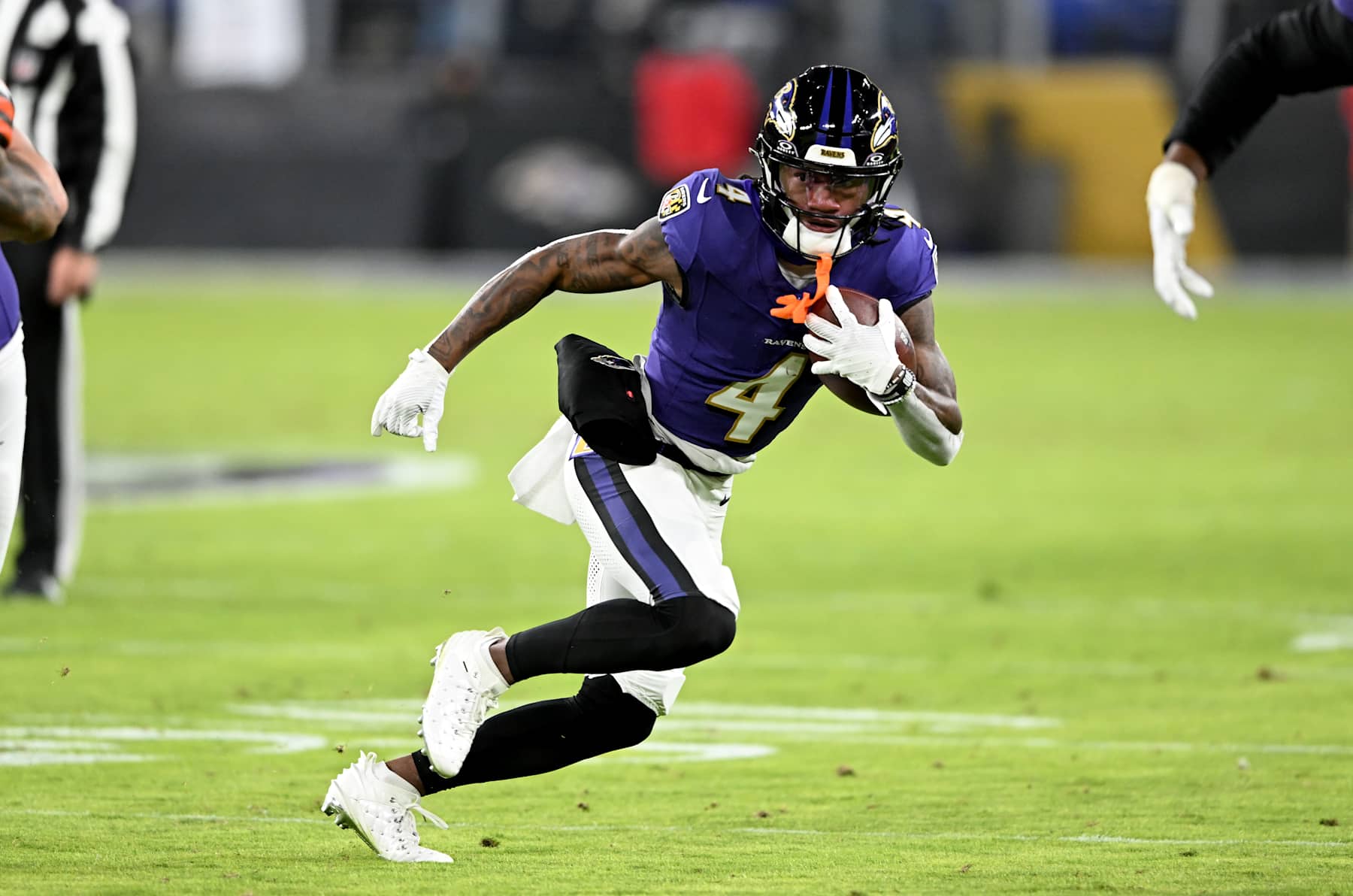 BALTIMORE, MARYLAND - JANUARY 04: Zay Flowers #4 of the Baltimore Ravens runs with the ball after making a catch against the Cleveland Browns at M&T Bank Stadium on January 04, 2025 in Baltimore, Maryland. (Photo by G Fiume/Getty Images)