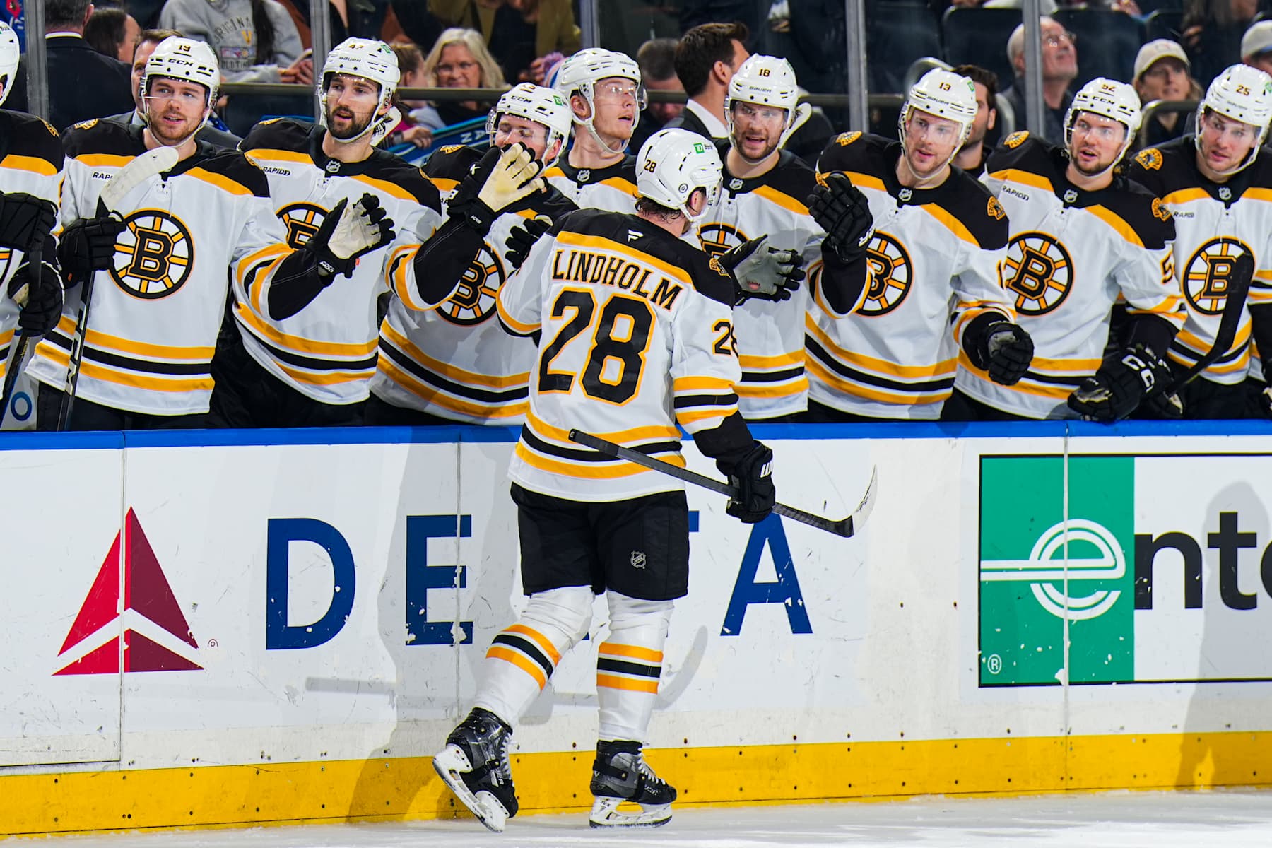 NEW YORK, NEW YORK - JANUARY 02: Elias Lindholm #28 of the Boston Bruins celebrates with teammates after scoring a goal in the second period against the New York Rangers at Madison Square Garden on January 2, 2024 in New York City. (Photo by Jared Silber/NHLI via Getty Images)