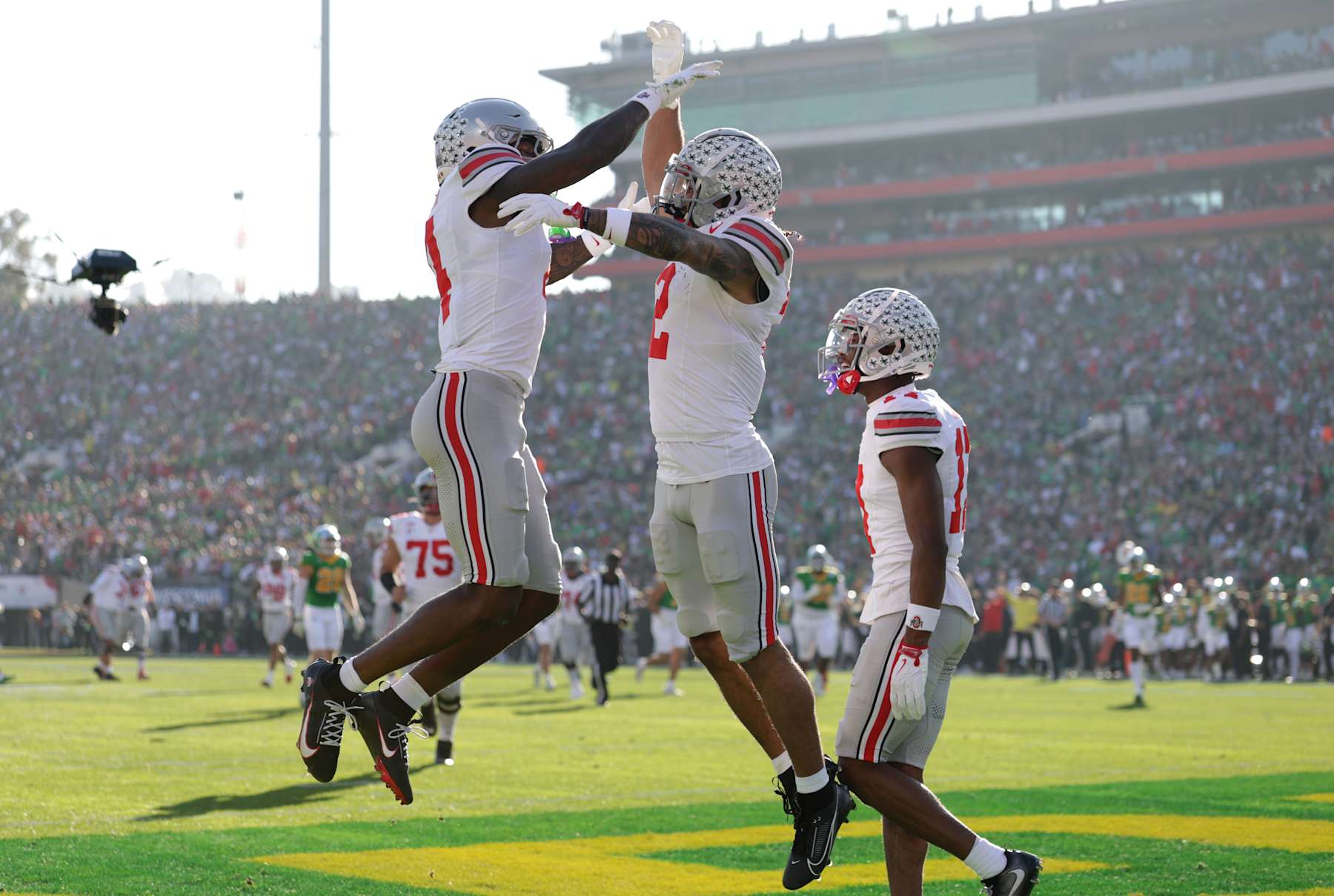 PASADENA, CALIFORNIA - JANUARY 01: Emeka Egbuka #2 of the Ohio State Buckeyes celebrates a touchdown with Jeremiah Smith #4 during the first quarter against the Oregon Ducks during the Rose Bowl Game Presented by Prudential at Rose Bowl Stadium on January 01, 2025 in Pasadena, California. (Photo by Sean M. Haffey/Getty Images)