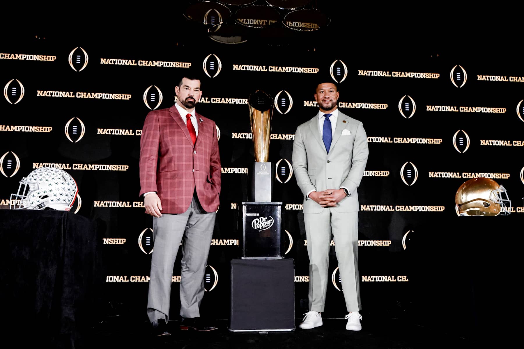 ATLANTA, GA - JANUARY 19: Head Coaches Ryan Day of the The Ohio State Buckeyes (L) and Marcus Freeman of the Notre Dame Fight Irish pose with the National Championship Trophy by Dr. Pepper after the CFP National Championship Head Coaches News Conference at the Westin Peachtree Plaza Hotel on January 19, 2025 in Atlanta, Georgia. (Photo by Don Juan Moore/Getty Images)