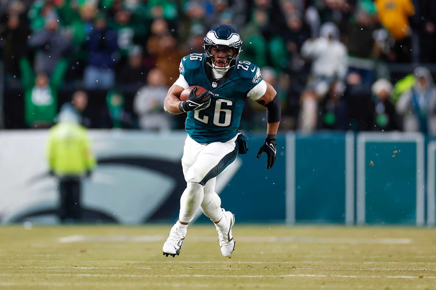 PHILADELPHIA, PENNSYLVANIA - JANUARY 19: Saquon Barkley #26 of the Philadelphia Eagles runs for a touchdown in the first quarter during the NFC Divisional Playoff game against the Los Angeles Rams at Lincoln Financial Field on January 19, 2025 in Philadelphia, Pennsylvania. (Photo by Brandon Sloter/Getty Images)