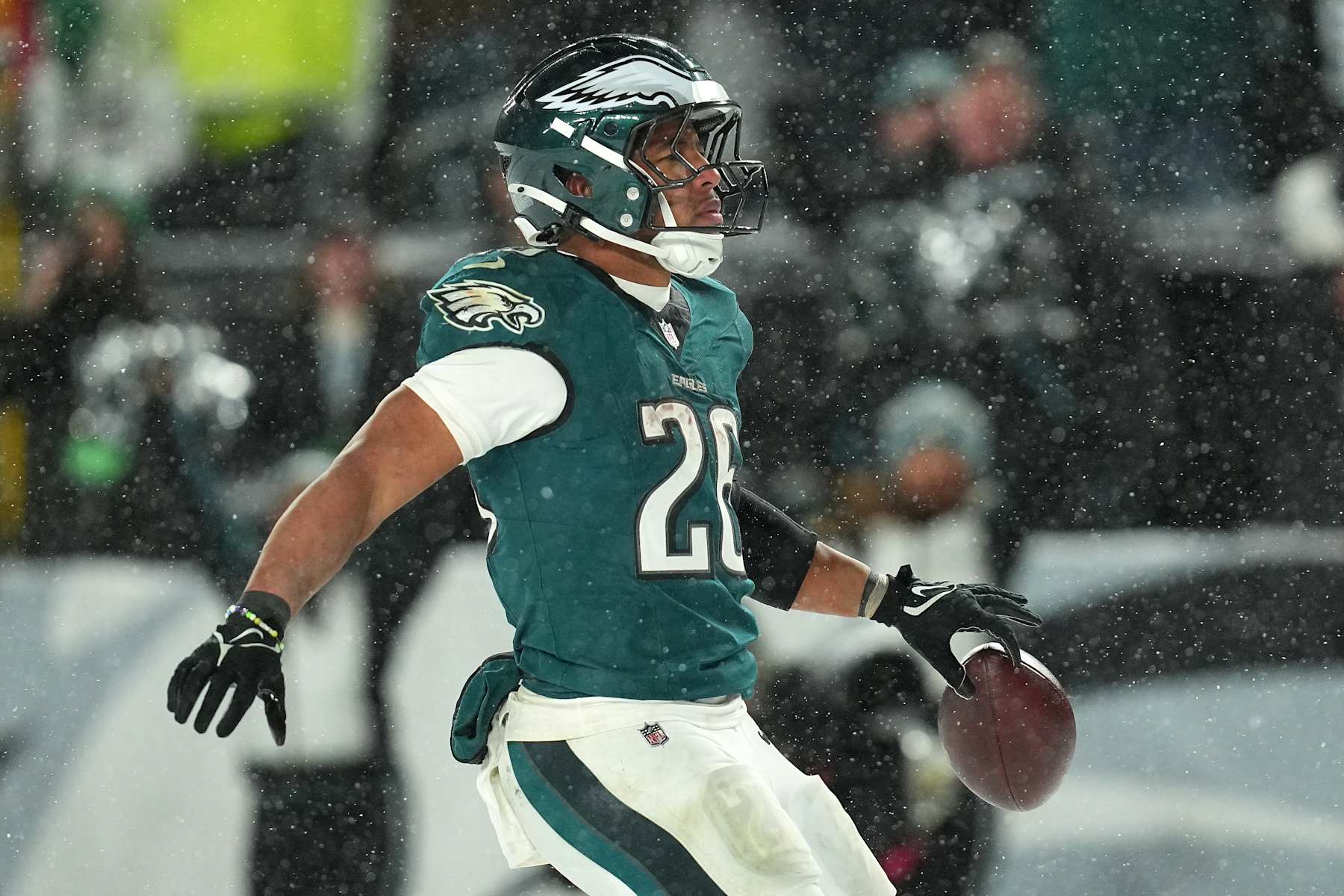 PHILADELPHIA, PENNSYLVANIA - JANUARY 19: Saquon Barkley #26 of the Philadelphia Eagles runs the ball for a 78-yard touchdown against the Los Angeles Rams during the fourth quarter in the NFC Divisional Playoff at Lincoln Financial Field on January 19, 2025 in Philadelphia, Pennsylvania. (Photo by Mitchell Leff/Getty Images)