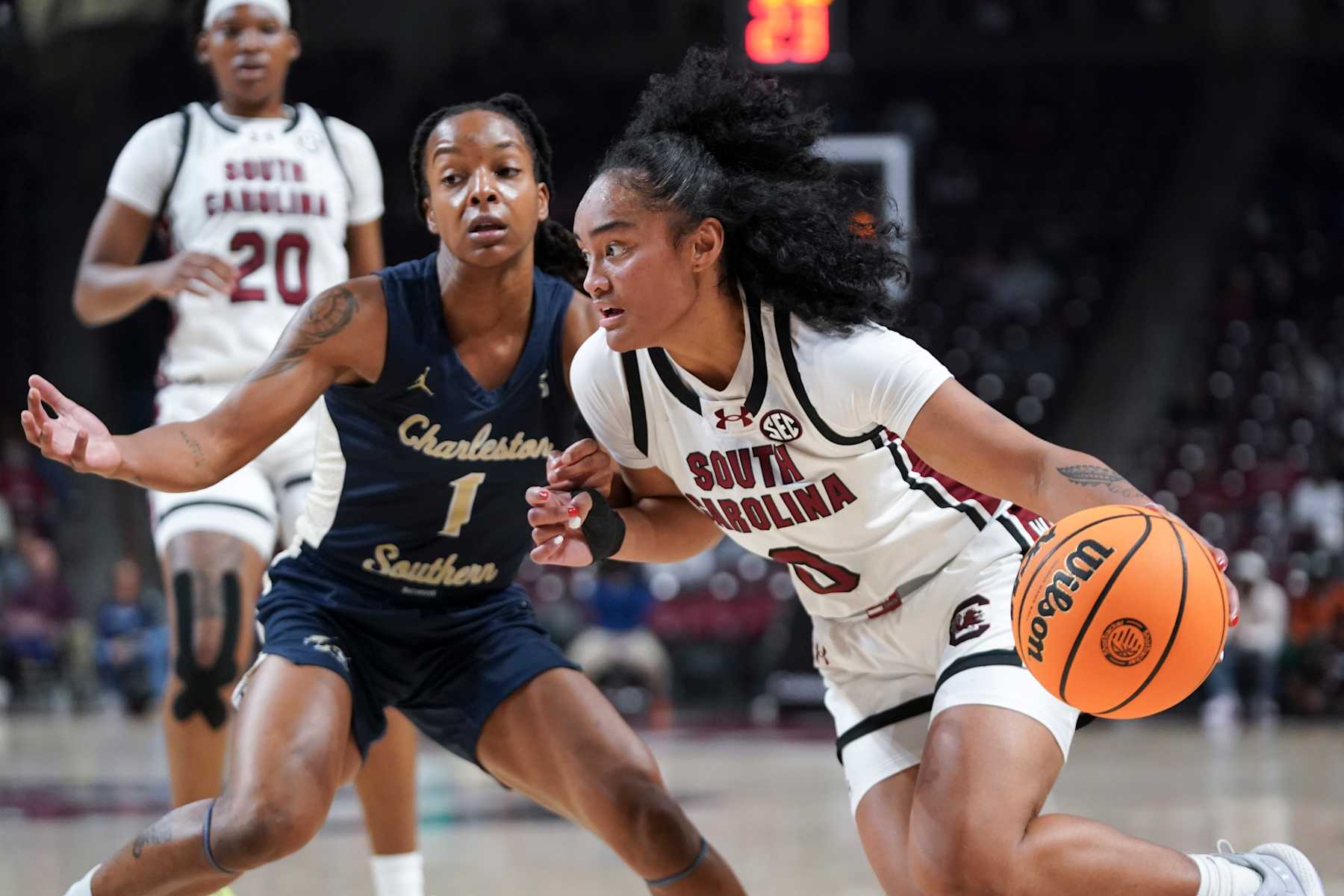 COLUMBIA, SOUTH CAROLINA - DECEMBER 19: Te-Hina Paopao (0) of the South Carolina Gamecocks drives to the hoop against Catherine Alben (1) of the Charleston Southern Buccaneers during the first quarter of an NCAA women's basketball game at Colonial Life Arena on December 19, 2024 in Columbia, South Carolina. The South Carolina Gamecocks won 82-46. (Photo by Sean Rayford/Getty Images)