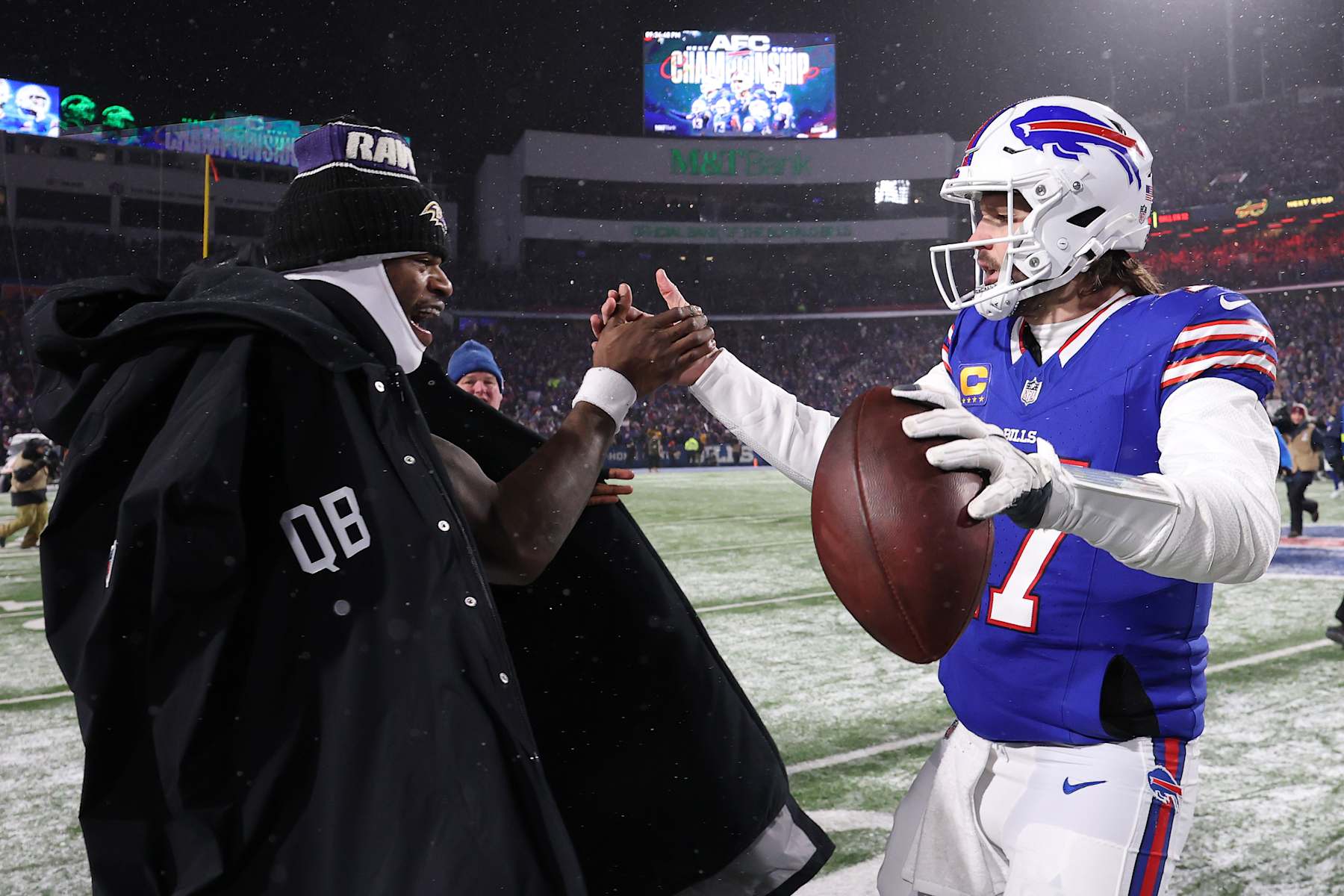 ORCHARD PARK, NEW YORK - JANUARY 19: Lamar Jackson #8 of the Baltimore Ravens and Josh Allen #17 of the Buffalo Bills embrace after the AFC Divisional Playoff game at Highmark Stadium on January 19, 2025 in Orchard Park, New York.  (Photo by Al Bello/Getty Images)