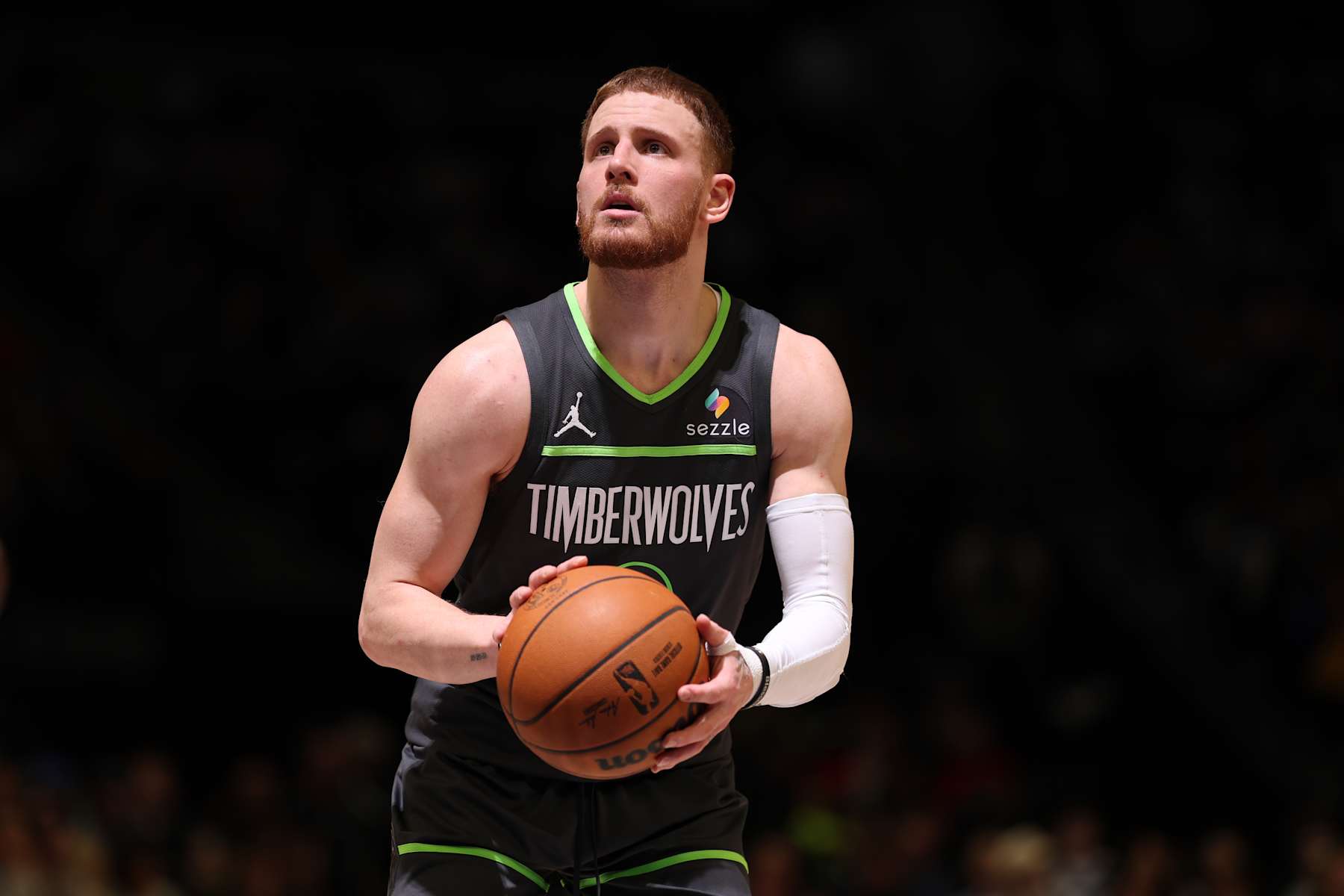 MINNEAPOLIS, MN -  JANUARY 15:  Donte DiVincenzo #0 of the Minnesota Timberwolves shoots a free throw during the game against the Golden State Warriors on January 15, 2025 at Target Center in Minneapolis, Minnesota. NOTE TO USER: User expressly acknowledges and agrees that, by downloading and or using this Photograph, user is consenting to the terms and conditions of the Getty Images License Agreement. Mandatory Copyright Notice: Copyright 2025 NBAE (Photo by David Sherman/NBAE via Getty Images)