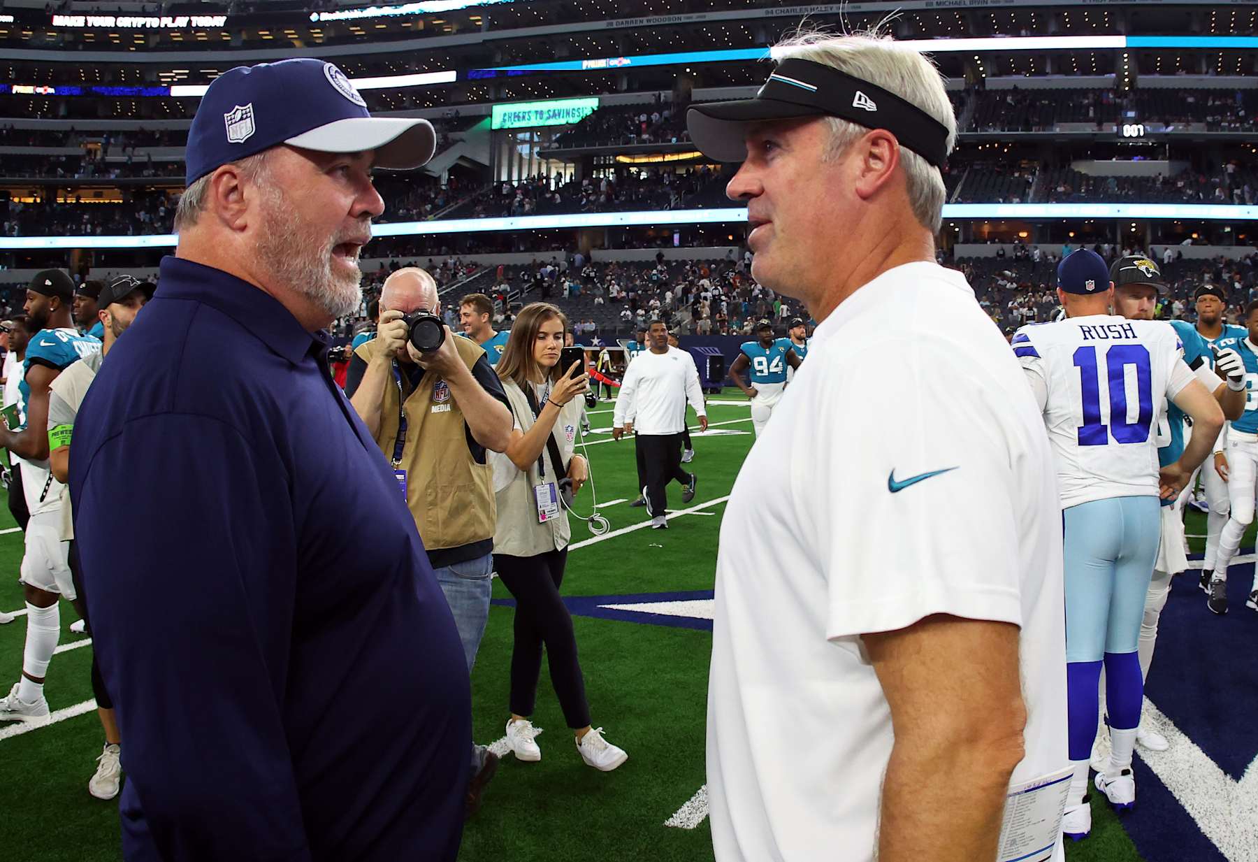 ARLINGTON, TEXAS - AUGUST 12: Mike McCarthy, head coach of the Dallas Cowboys talks with Jacksonville Jaguars head coach Doug Pederson after a preseason game at AT&T Stadium on August 12, 2023 in Arlington, Texas. (Photo by Richard Rodriguez/Getty Images)