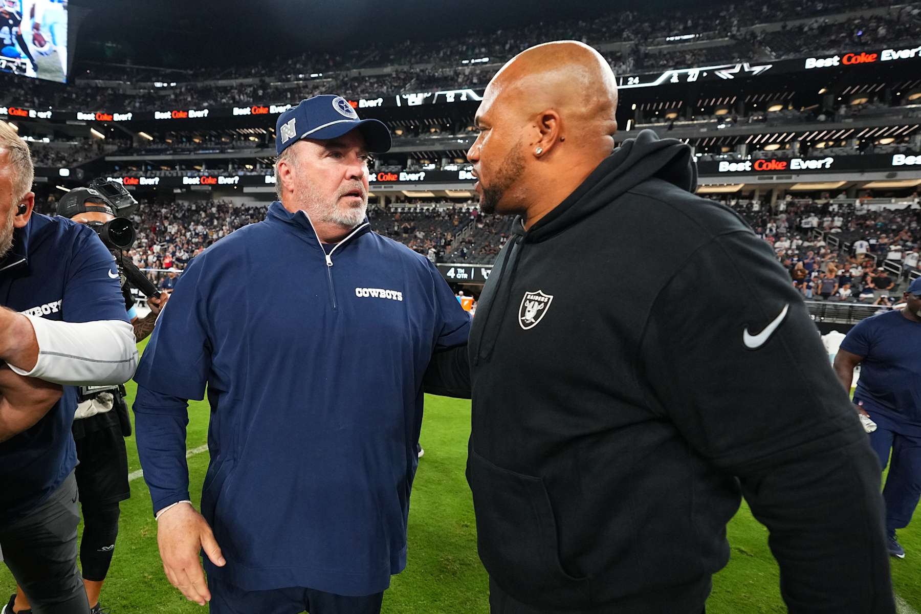 LAS VEGAS, NEVADA - AUGUST 17: (L-R) Head coach Mike McCarthy of the Dallas Cowboys speaks to head coach Antonio Pierce of the Las Vegas Raiders after a preseason game at Allegiant Stadium on August 17, 2024 in Las Vegas, Nevada. The Cowboys defeated the Raiders 27-12. (Photo by Chris Unger/Getty Images)