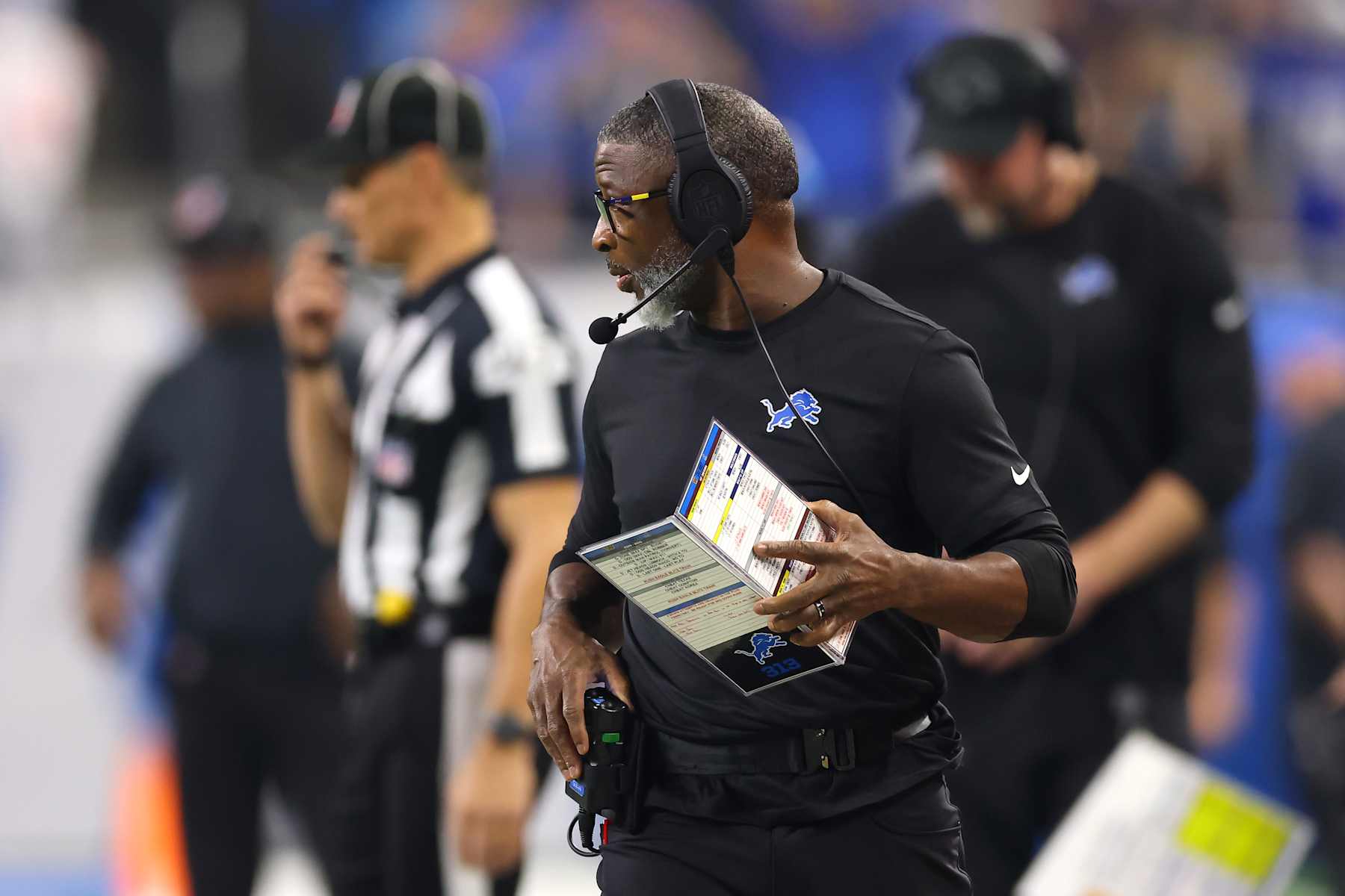 DETROIT, MICHIGAN - JANUARY 18: Defensive coordinator Aaron Glenn of the Detroit Lions looks on during the first quarter against the Washington Commanders in the NFC Divisional Playoff at Ford Field on January 18, 2025 in Detroit, Michigan.  (Photo by Gregory Shamus/Getty Images)