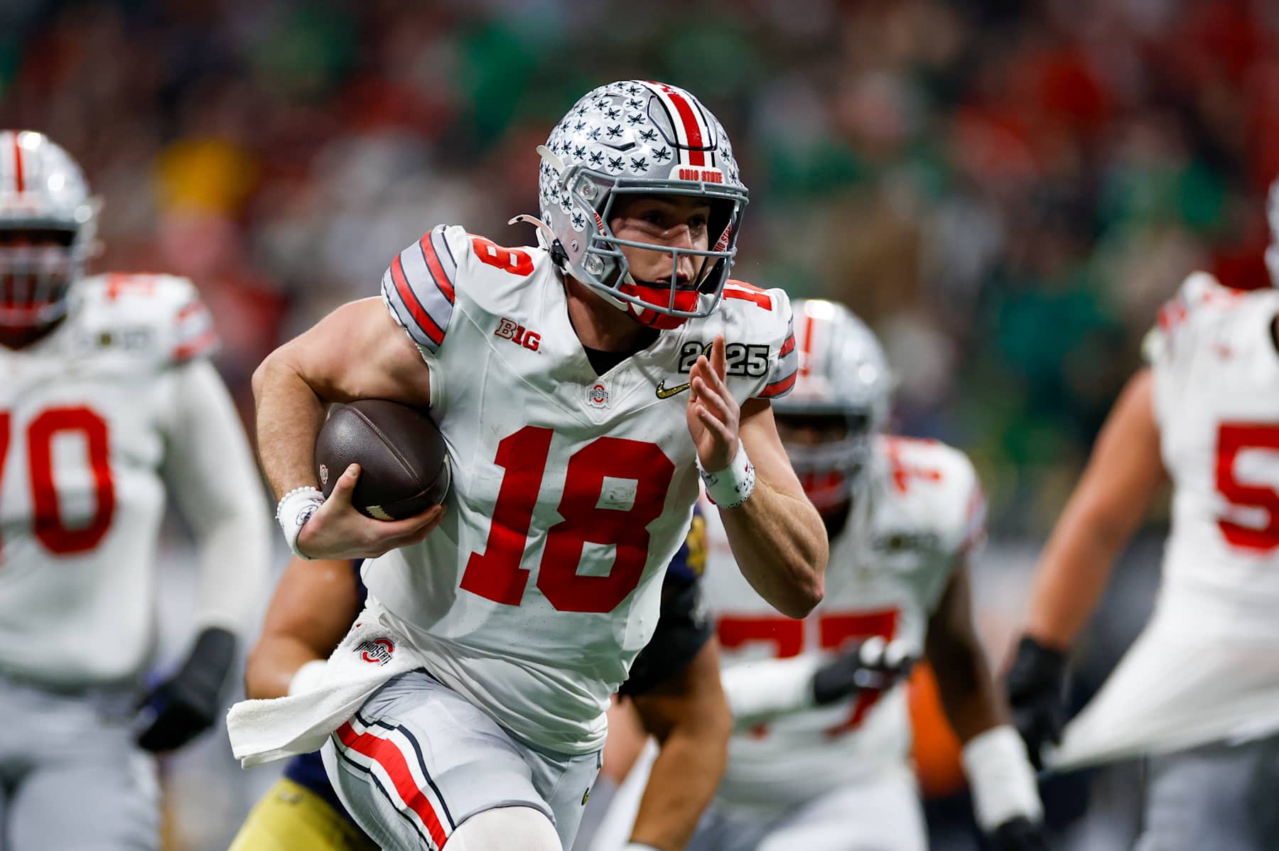 ATLANTA, GA - JANUARY 20: Quarterback Will Howard #18 of the Ohio State Buckeyes runs with the ball during the Ohio State Buckeyes versus Notre Dame Fighting Irish College Football Playoff National Championship game on January 20, 2025, at Mercedes-Benz Stadium in Atlanta, GA. (Photo by David Rosenblum/Icon Sportswire via Getty Images)