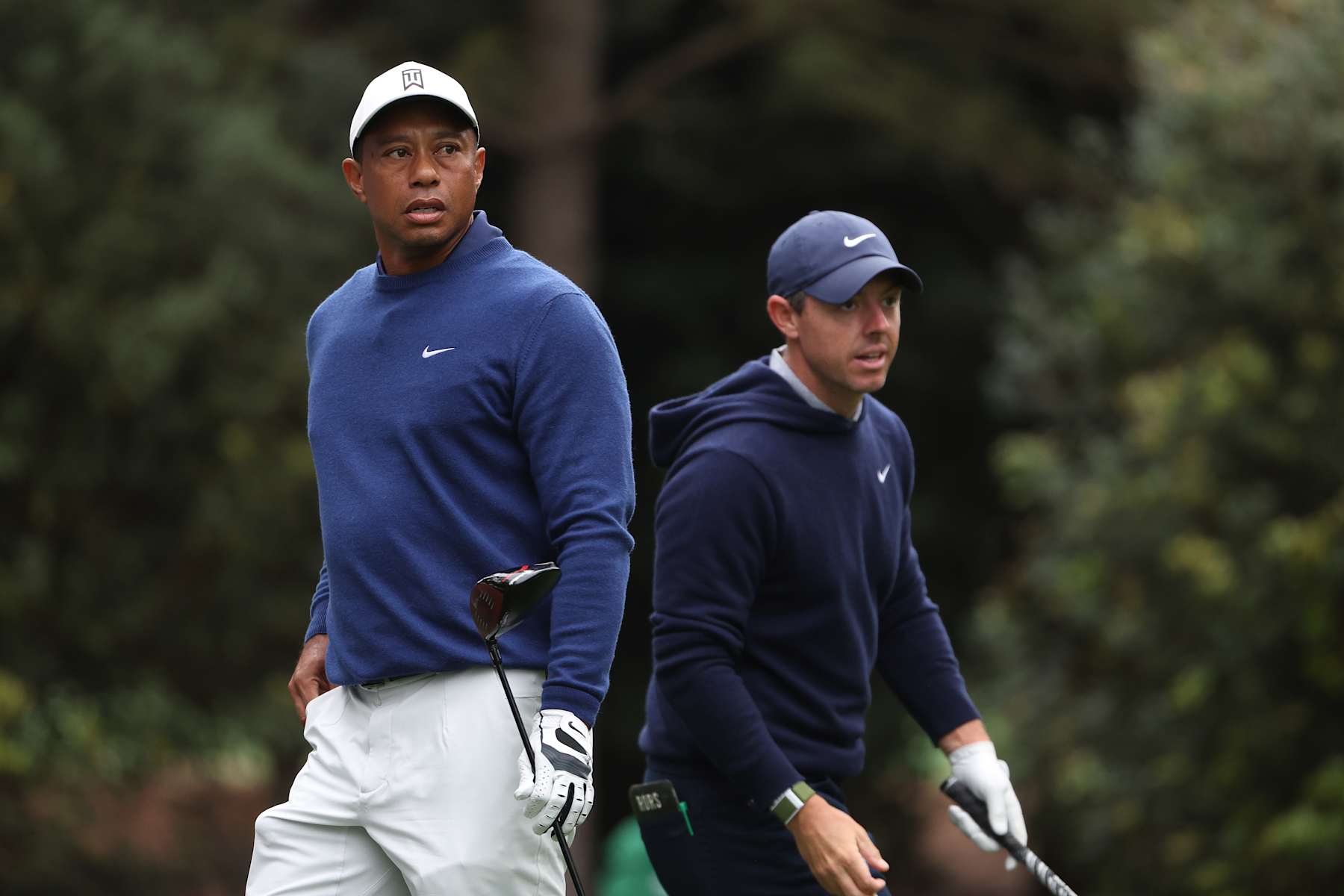 AUGUSTA, GEORGIA - APRIL 03: Tiger Woods of the United States and Rory McIlroy of Northern Ireland look on from the 11th tee during a practice round prior to the 2023 Masters Tournament at Augusta National Golf Club on April 03, 2023 in Augusta, Georgia. (Photo by Christian Petersen/Getty Images)