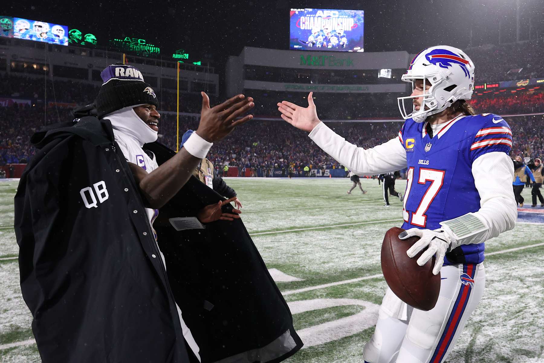 ORCHARD PARK, NEW YORK - JANUARY 19: Lamar Jackson #8 of the Baltimore Ravens and Josh Allen #17 of the Buffalo Bills embrace after the AFC Divisional Playoff gameat Highmark Stadium on January 19, 2025 in Orchard Park, New York.  (Photo by Al Bello/Getty Images)
