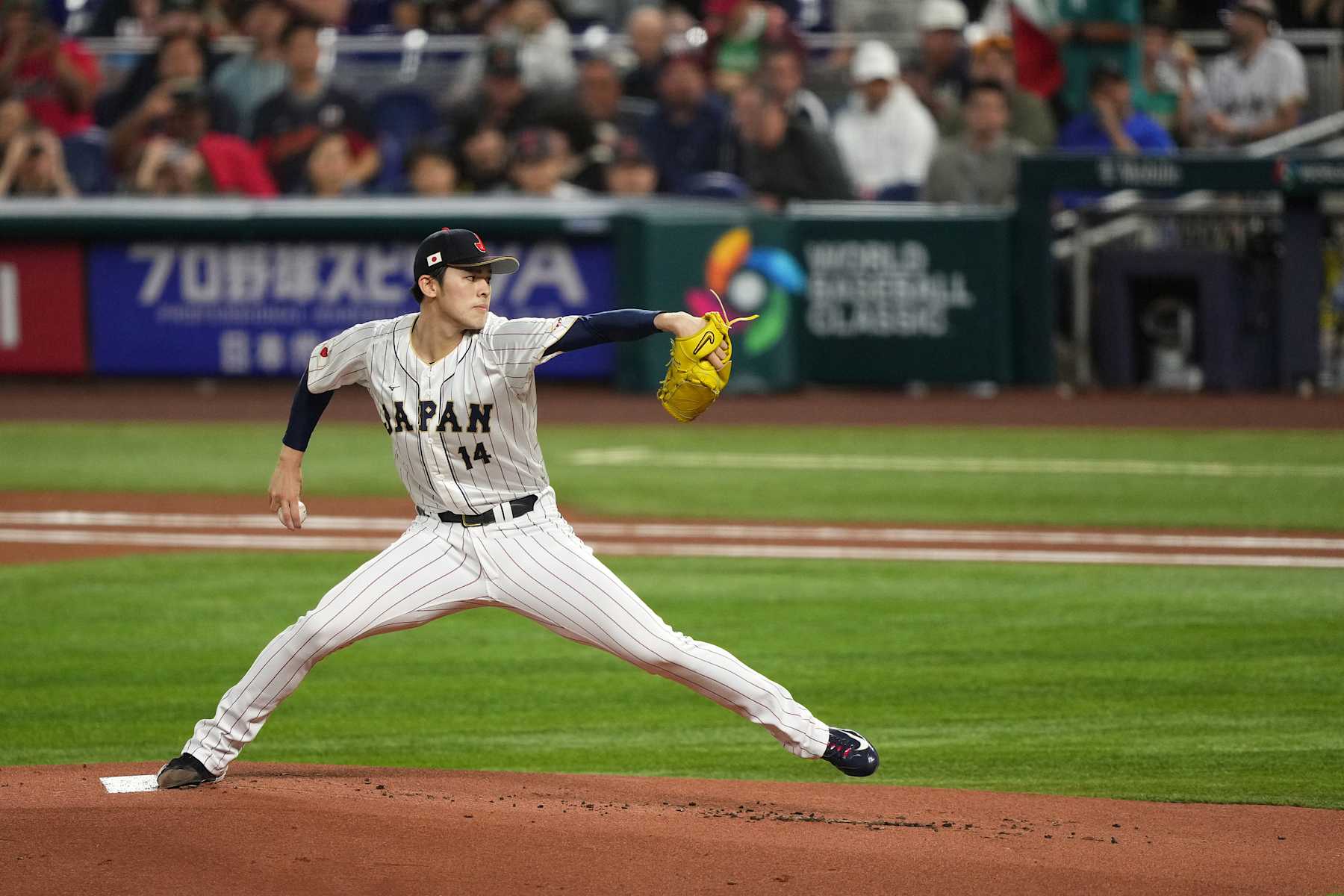 MIAMI, FL - MARCH 20: Roki Sasaki #14 of Japan delivers a pitch in the first inning against Mexico at loanDepot park on March 20, 2023 in Miami, Florida. (Photo by Jasen Vinlove/Miami Marlins/Getty Images)